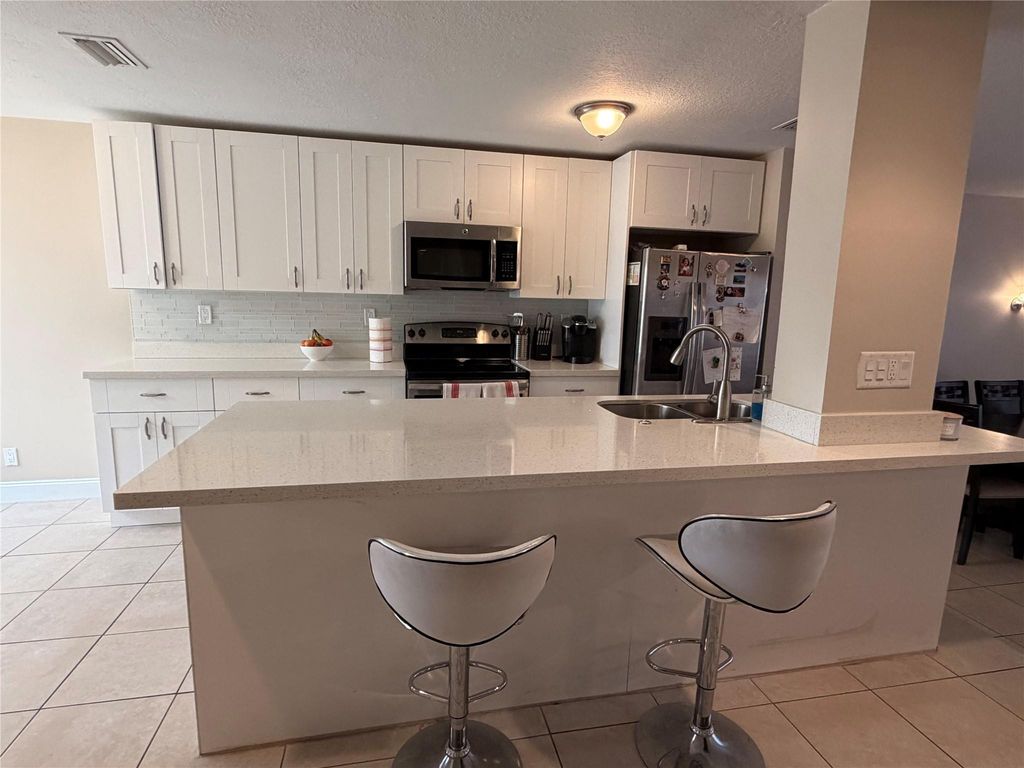 Photo of 8251 NW 8th Place, Plantation, FL 33324 (MLS # F10543570)