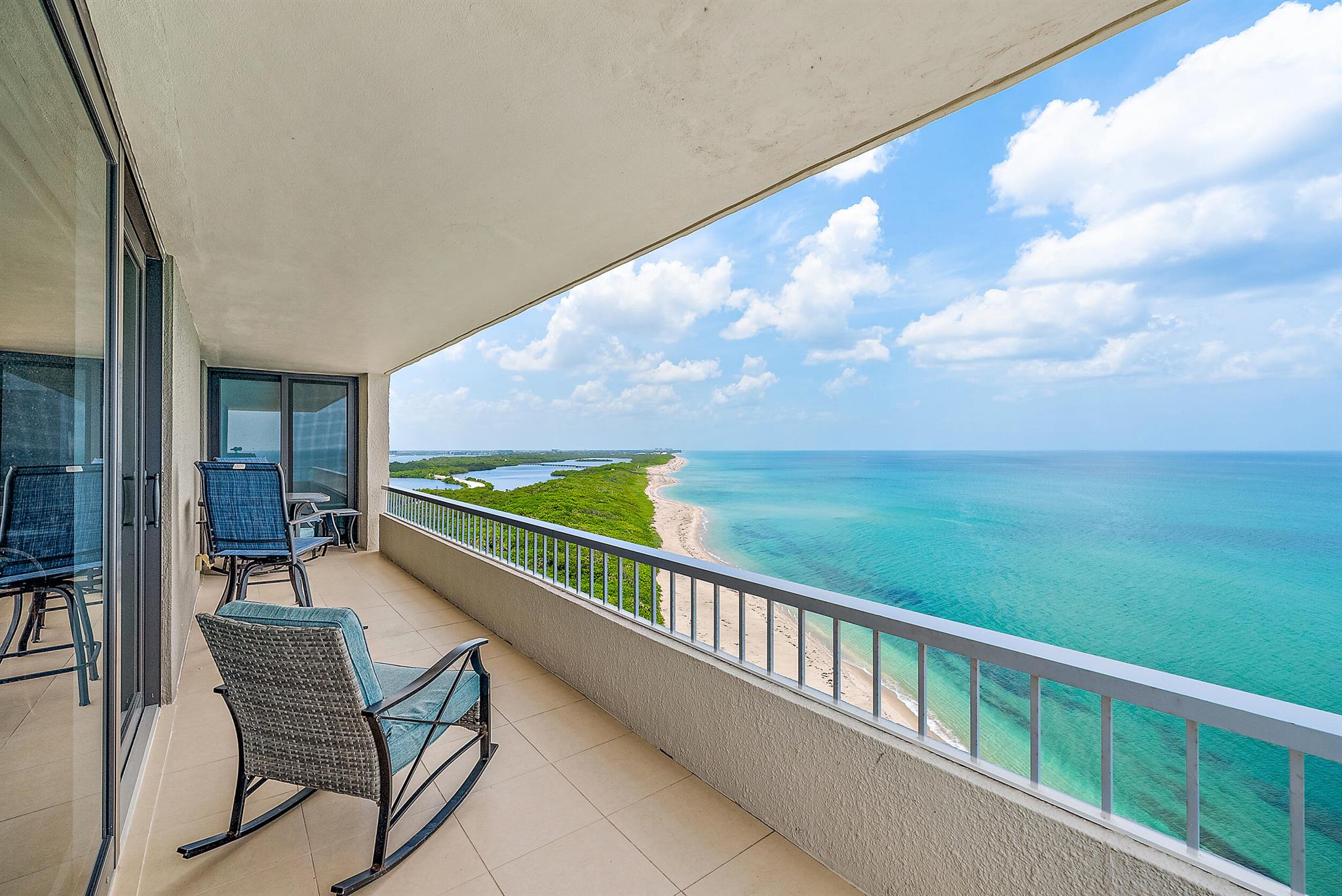 Escape this coming winter with panoramic views surrounded by gorgeous blue & turquoise water overlooking the ocean to the east, John MacArthur State Park just north with a wrap around balcony facing south. This light and bright corner residence has incredible water views from every room with floor to ceiling impact glass windows and slider doors, tile floors throughout, updated kitchen & baths with granite counter tops. Relax watching the boats cruise by while enjoying dining & drinks on your balcony surrounded by wide open views everywhere! This property boasts some of the best views on Singer Island! See Supplement...