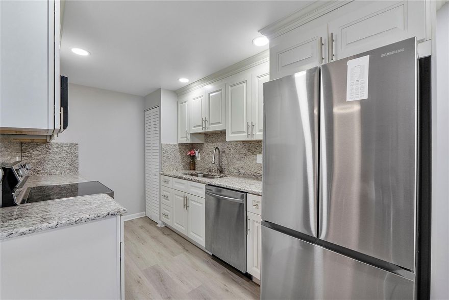 NOW READY AND AVAILABLE, AGGRESSIVELY PRICED, COMPLETELY REMODELED 2 BEDROOMS 1.5 BATHROOMS LOCATED AT HARWOOD E OF CENTURY VILLAGE. WITH WATER VIEWS, THIS SELLER HAS SPARED NO EXPENSE FROM NEW FLOORING, UPDATED KITCHEN, NEWER AC, WATER HEATER, AND FULL IMPACT WINDOWS AND DOORS. WATER VIEWS &  AMMENITIES GALORE, YOU DON'T WANT TO MISS THIS OPPORTUNITY!