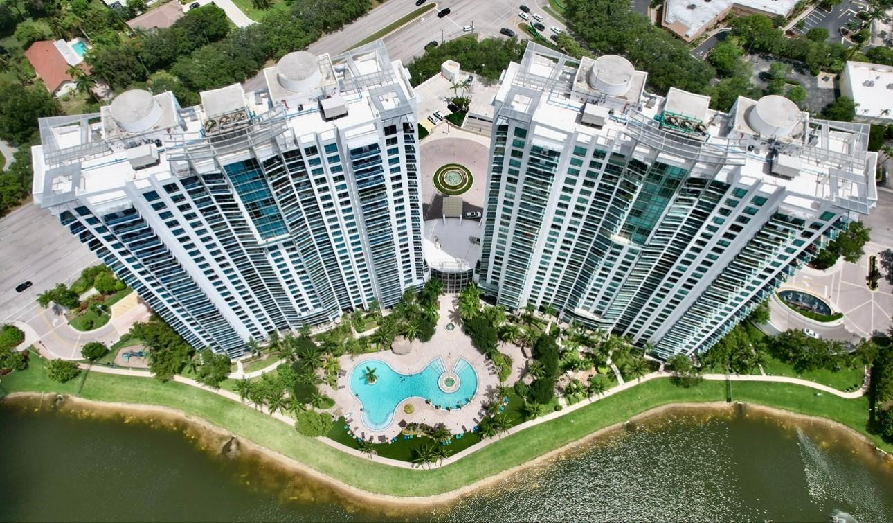 Experience luxury living in this stunning corner apartment featuring 3 bedrooms, 3 full bathrooms, and an ultra-rare 3-car garage parking—all conveniently located on the first floor of the garage. With a total area of 1,570 sq ft, this beautifully designed unit boasts unobstructed sunset, Everglades, and lake views from its double balconies. The spacious great room and modern kitchen are perfect for entertaining, while impact-resistant windows offer peace of mind. Pet-friendly (up to 2 pets allowed), this home includes cable, water, and internet in the maintenance fee. Enjoy resort-style living with Tao’s luxurious amenities: