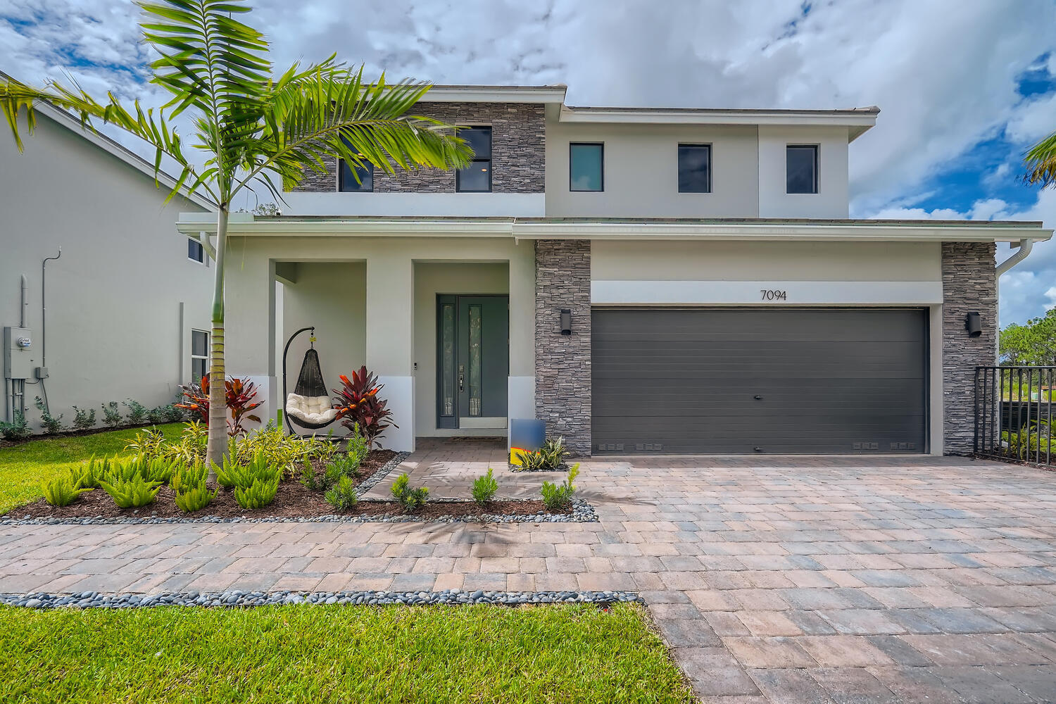 MODEL HOME for sale! The Ponte Vedra plan features 5 bedrooms, 4 full baths, loft, impact glass windows and concrete block construction on both levels! The interior ''Haven'' package includes glacier gray shaker cabinets, quartz kitchen countertop and 24'' porcelain tile throughout the first floor living areas. This home features custom decor features, kitchen appliances and washer/dryer. Furniture is not included. CALL FOR A TOUR AND MOVE IN SPECIALS - Restrictions may apply* Pictures, photographs, features, colors and sizes are approximate for illustrations purposes only and will vary from the homes as built. These are not of the actual home but are similar to the home being built.