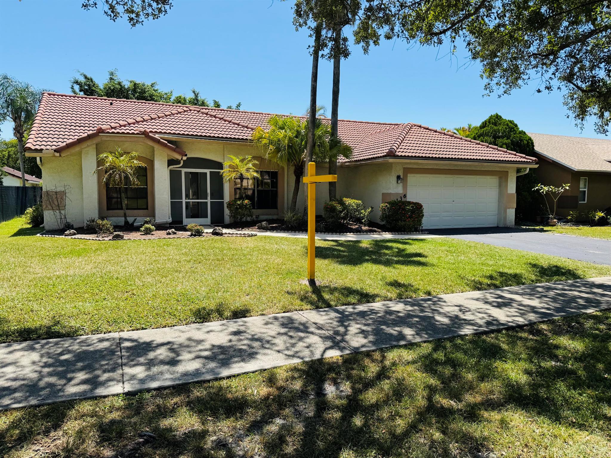 COME and enjoy the greatness of Coconut Creek. The property boasts 3 bedrooms, 2 baths, and a 2-car garage, offering ample space for family living. One of the standout features is the huge yard, surrounded by tall trees, providing a serene and private outdoor space. The community has playgrounds and ball courts just a short walk away, ensuring there's always something fun to do. The home is situated in a wonderful family neighborhood near A+ schools, making it an ideal choice for families. You'll also have easy access to local parks, recreation areas, and a nature preserve, perfect for those who love the outdoors. Coconut Creek's greatness is just moments away from Boca Raton, Coral Springs, and Ft Lauderdale, Close to all major highways and just minutes away from Florida's best beac