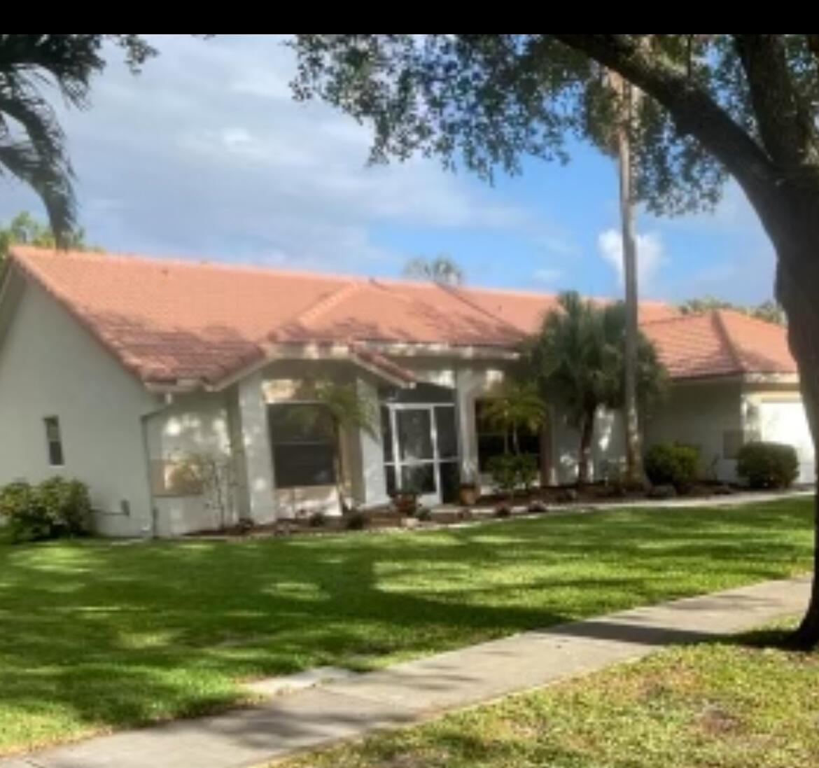 COME and enjoy the greatness of Coconut Creek. The property boasts 3 bedrooms, 2 baths, and a 2-car garage, offering ample space for family living. One of the standout features is the huge yard, surrounded by tall trees, providing a serene and private outdoor space. The community has playgrounds and ball courts just a short walk away, ensuring there's always something fun to do. The home is situated in a wonderful family neighborhood near A+ schools, making it an ideal choice for families. You'll also have easy access to local parks, recreation areas, and a nature preserve, perfect for those who love the outdoors. Coconut Creek's greatness is just moments away from Boca Raton, Coral Springs, and Ft Lauderdale, Close to all major highways and just minutes away from Florida's best beac