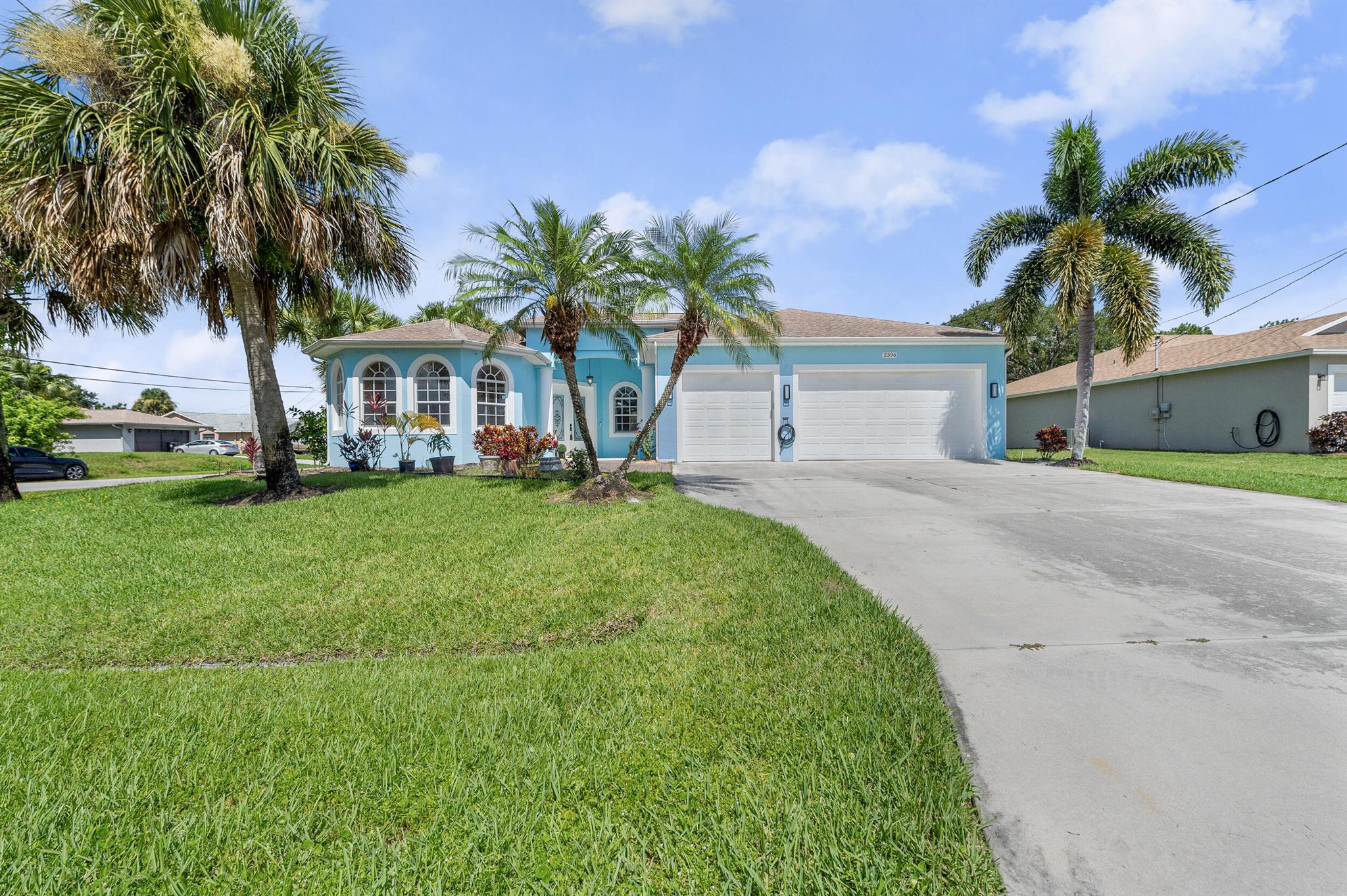 Welcome to Your Florida Paradise! Incredible Location & Price - Packed with Features!-Don't miss this rare opportunity to own a stunning 3 Bedroom, 2 Bath, 3-Car Garage CBS Home with brand-new flooring in the Master Bedroom and Bath! A sprawling flex-space den easily converts to a 4th bedroom or private in-law suite, perfect for growing families or multi-generational living.Step outside to your private backyard oasis--a beautifully screened saltwater pool with color-changing lights, and a fully equipped Summer Kitchen featuring a built-in grill, sink, mini-fridge, hot/cold water, and even an outdoor TV--ideal for entertaining year-round.