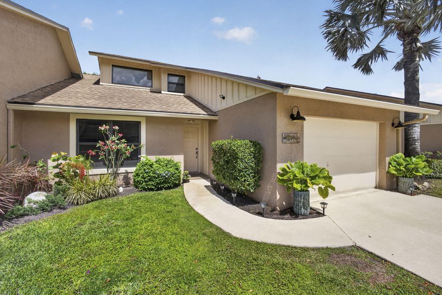 Welcome home to this exceptional residence in the highly sought after Park Place of Wellington, where a 2020 roof, impact windows, and beautiful updates throughout create the perfect blend of comfort, style, and peace of mind. Just minutes from Wellington International and the National Polo Center, and set in the heart of Wellington's renowned equestrian community, this beautifully remodeled residence also offers walking distance to the Wellington Amphitheater, where you can enjoy concerts, food truck events, art festivals, thrift sales, and more. Inside, you are welcomed by a stunning foyer with an artistic light fixture and elegant marble floors. Fresh light gray paint, 24 inch marble tile flooring, and vaulted ceilings create a bright, open, and sophisticated feel throughout the home.   The updated kitchen is designed for both everyday living and entertaining, featuring soft gray quartz countertops, white shaker cabinetry, brand new Samsung appliances, upgraded recessed lighting with 8 mini LEDs, a generous pantry, and a charming breakfast nook with custom recessed lighting in the overhead soffit.  The family room is especially impressive with soaring 18 foot ceilings and multiple sliding glass doors that open to an oversized, fully enclosed patio, creating the perfect year round space for relaxing or entertaining. Beyond the patio, the backyard offers a peaceful open setting with plenty of room to enjoy the outdoors.  The primary suite is a true retreat, complete with 16 foot ceilings, direct patio access, a large walk in closet, and a fully remodeled bathroom with dual sinks, custom designer mirrors, and a marble shower with pebble tile detailing. Upstairs, the loft functions beautifully as a second primary style suite with its own private bathroom, wood plank flooring, and vaulted ceilings. Additional bedrooms are spacious and offer ample closet space.  Thoughtful upgrades continue throughout, including a tastefully updated half bath, Nest thermostat, brand new washer and dryer, and a garage that feels like an extension of the home with an extra refrigerator, utility sink, a nook for a full size Craftsman workbench, high speed garage door opener, and pull down stairs to a large attic space.  Located in one of Wellington's most desirable communities, Park Place offers outstanding convenience and value. The HOA power washes driveways every 6 months, covers roof insurance for damage, and the community is being freshly painted right now. All of this, close to A rated schools, shopping, dining, I 95, the Turnpike, and the beach.