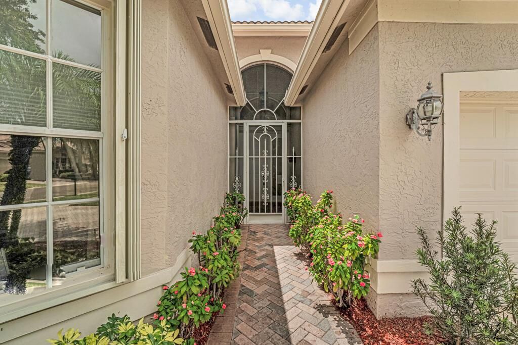Photo of 7751 Ocean Sunset Drive, Lake Worth, FL 33467 (MLS # R11087942)