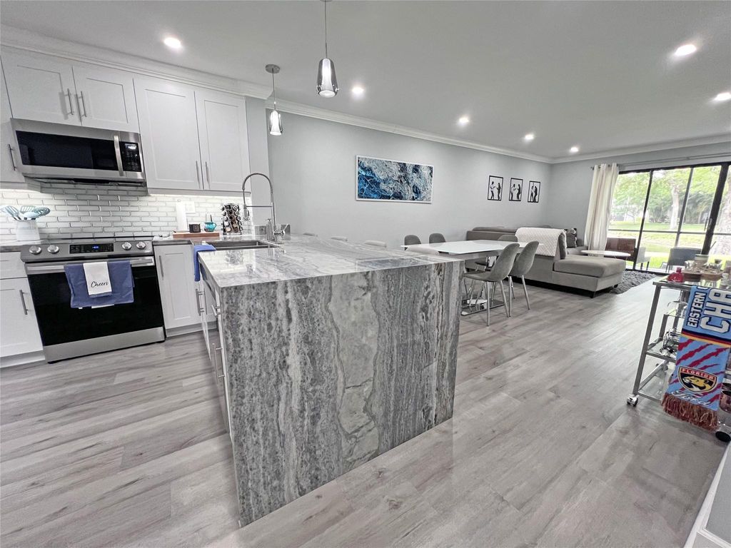 Photo of 4401 Carambola Circle #-, Coconut Creek, FL 33066 (MLS # F10443404)