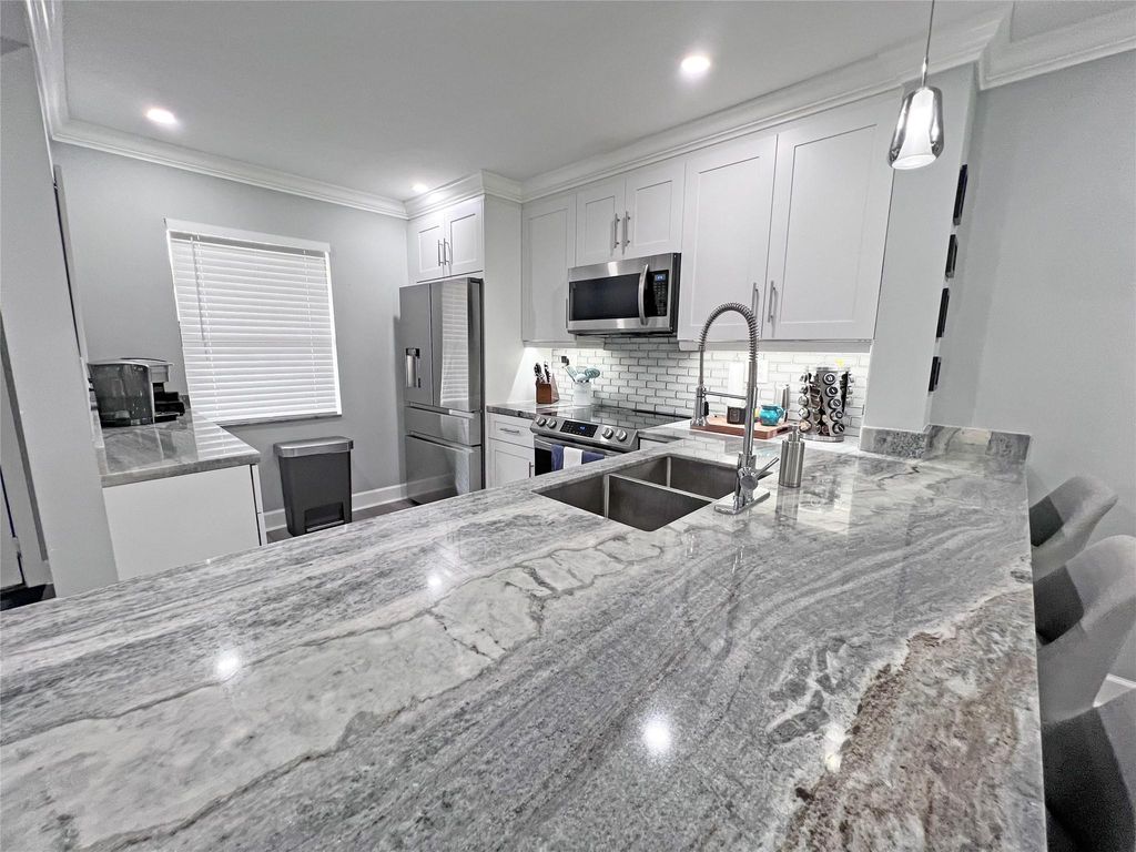 Photo of 4401 Carambola Circle #-, Coconut Creek, FL 33066 (MLS # F10443404)