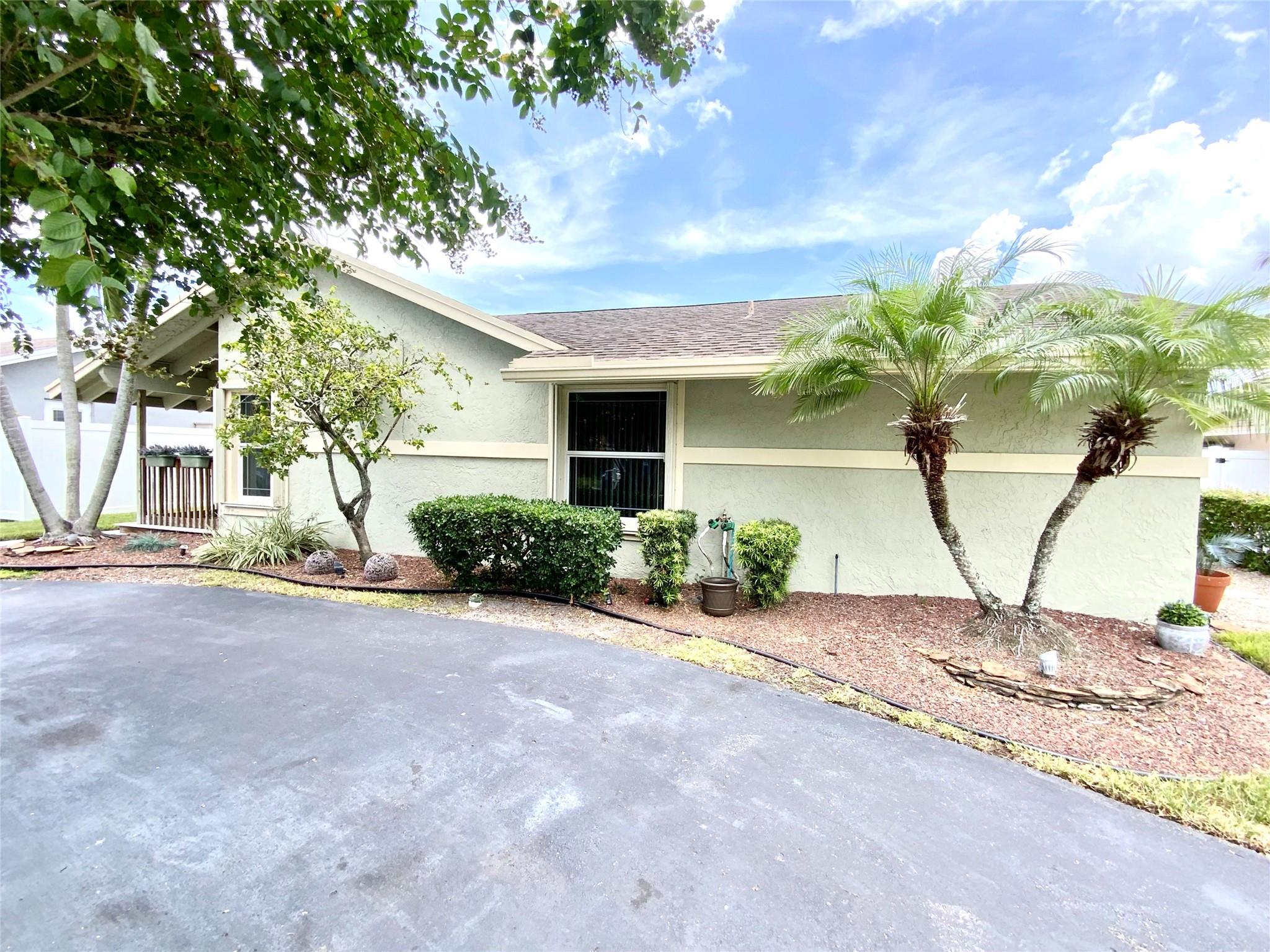 Nestled in the vibrant community of North Lauderdale! Come and see this gorgeous 3 bed, 2 bth Pool home complete with an extra den/office/flexible space. Relax on your porch out front or enjoy the serene surroundings out back and cool off in your pool! Features are second to none! Boasting a spacious kitchen including white cabinetry(accent lighting) and newer appliances. Updated bathrooms & toilets, elegant tile, wood/vinyl flooring. Hunter ceiling fan in every room! New AC(3mths)w/10yr parts & labor warranty, New Fence(6mths), security cameras, alarm system & ring doorbell! Upgraded 200 amp electrical panel(2yrs). Accordion shutters all around & front door-Impact rated! Painted 2 yrs ago and driveway w/black top seal coat(2yrs). Close to parks, schools, restaurants & much more!!