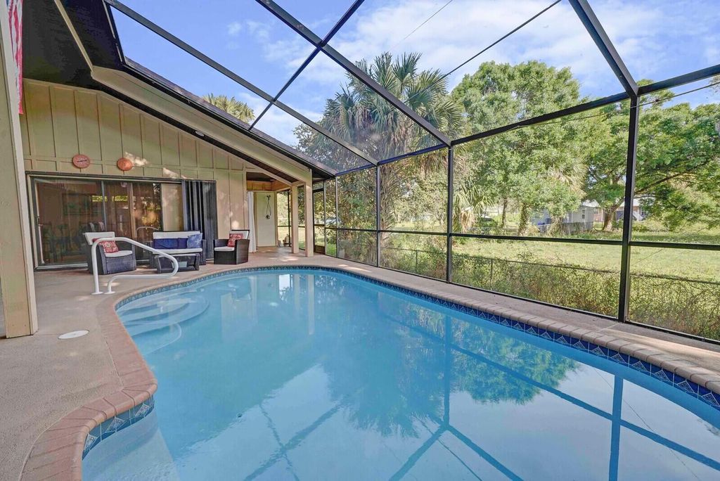 Photo of 522 SW Timber Trail, Stuart, FL 34997 (MLS # R10981484)