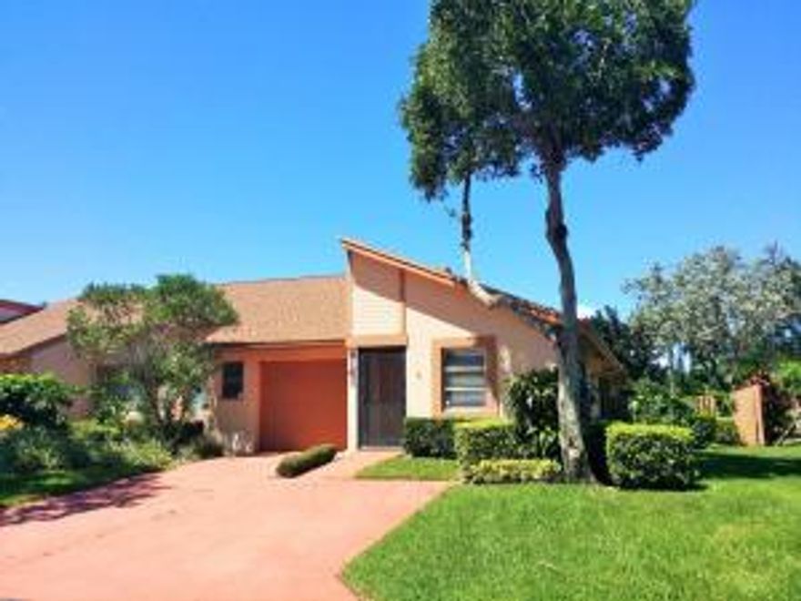 Bright and Spacious 2 bedroom, 2 full bath CORNER villa. Features vaulted ceilings, LARGE windows and sliding doors to the private tropical patio area with plenty of natural sunlight! This very well maintained villa also offers a one car garage, enclosed airconditioned Florida Room that doubles as a den, private partially fenced yard and patio.  Vaulted ceilings, light tile throughout, spacious master bedroom, separate laundry room. Bright, eat-in kitchen. GREAT LOCATION!  Enjoy scenic walking paths, lakes and fountains, several swimming pools, hot tubs, tennis and racquetball courts and more!