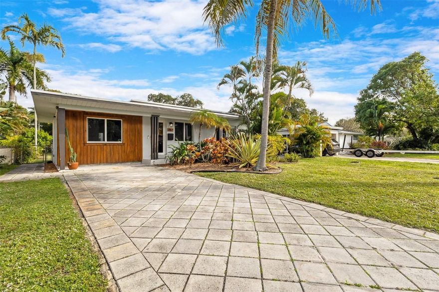 "Croissant Park", East Fort Lauderdale gem!  Remodeled 3/2 with huge back patio and massive yard big enough for a large pool.  Updated kitchen with granite countertops, ss appliances, new roof (2024), tankless hot water heater (2023), new AC (2021), impact windows, new flooring, updated bathrooms (1 with floating soaking tub, 1 with walk-in shower), paver driveway, and plenty of space!  Contemporary design that awaits your personal touches.  5-10 minutes to Fort Lauderdale Beach, Las Olas, downtown, Hugh Taylor Birch State Park and FLL airport. (Attention boaters: there is an easement in the alley in the back of the property that could provide allowance to back in trailer and keep securely stored in the rear of the property.)  This is a must see!