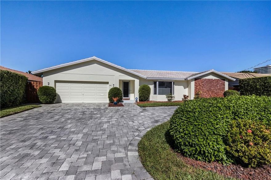 ENJOY WIDE WATER VIEWS ON 80 FEET OF DEEP WATER IN PRESTIGIOUS GATED COMMUNITY OF 255 HOMES!  SPLIT FLOOR PLAN HOME GREAT FOR ENTERTAINING! HAVE PIECE OF MIND WITH HURRICANE IMPACT WINDOWS AND DOORS. LOW MAINTENANCE LAWN WITH AUTO-IRRIGATION SYSTEM AND LIGHTED STEPS LEADING TO DUAL LEVEL 40' DOCK. KIDNEY SHAPED HEATED POOL, PAVERS, CABANA BATH AND 6 FT. LANAI FOR OUTDOOR SHADE. WIRED ALARM SYSTEM. NEW TILE ROOF 2002. FRESH EXTERIOR AND INTERIOR PAINT. NEW BERBER CARPET IN BEDROOMS. CORIAN COUNTER TOPS IN KITCHEN AND BATHS.  MANY LIGHTING UPGRADES. CROWN MOLDING THROUGHOUT. CLOSE TO SHOPPING, RESTAURANTS, MEDICAL SERVICES, & MORE. PRIVATE SIDEWALK/PATH IN COMMUNITY LEADING TO A1A AND THE OCEAN. HOA FEE OF $150 ANNUALLY.  MANDATORY TO MAINTAIN ENTRANCE AND PRIVATE WALKWAY. HOT WATER CIRCULATION PUMP IN MASTER BATH AND KITCHEN FOR IMMEDIATE HOT WATER.  BUILT-IN WALL UNIT IN FAMILY ROOM. NEW ROOF IN 2002. NEW RETAINING WALL AND PAVERS IN BACK IN 2011. NEW PAVERS IN FRONT IN 2015.