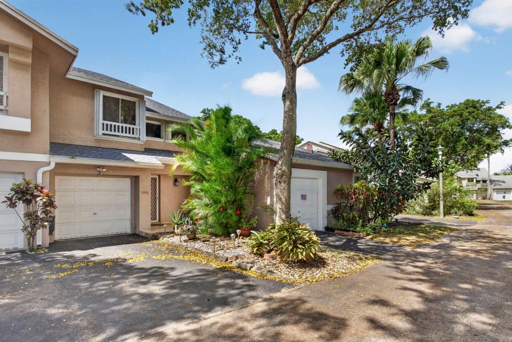 Photo of 1991 Discovery Circle E, Deerfield Beach, FL 33442 (MLS # B26087290)