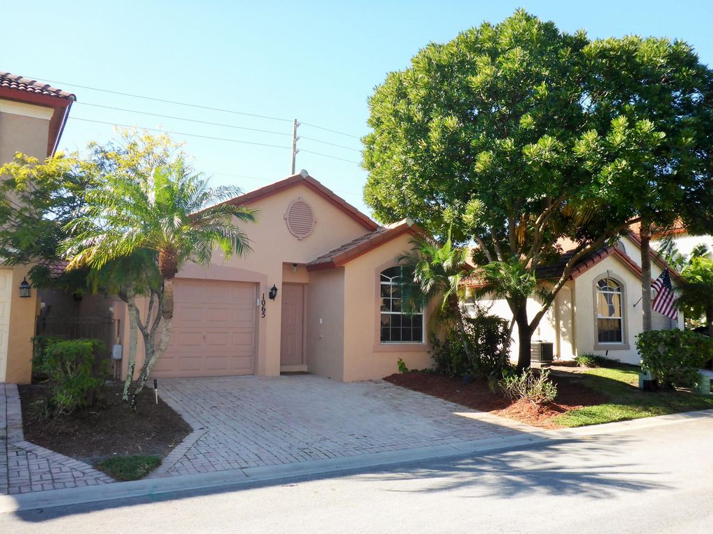 Photo of 1065 Via Jardin, Riviera Beach, FL 33418 (MLS # R10773371)