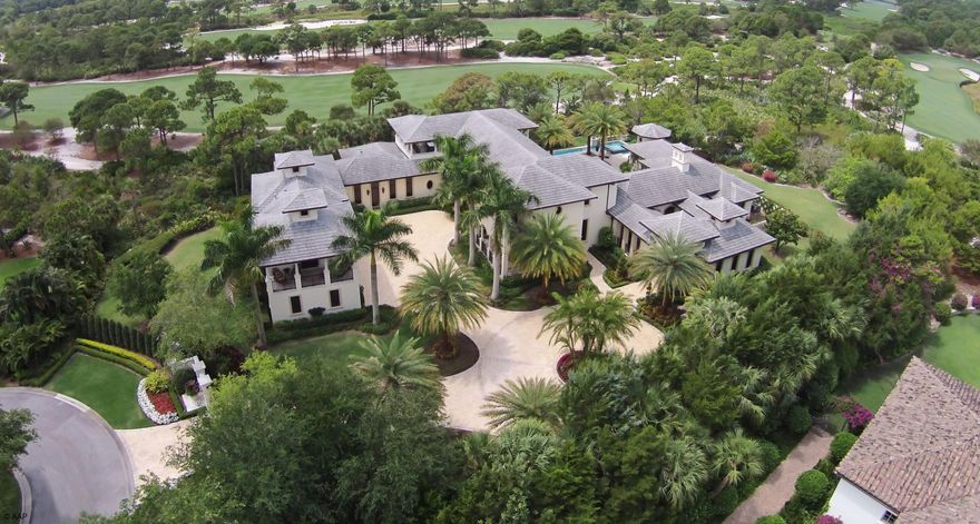 Exceptional West Indies style custom estate with clean transitional interiors located on the 6th fairway of the Jack Nicklaus signature course at The Bears Club.  The property features additional golf views of the 7th and 8th holes.The home was originally built in 2007 and extensively renovated in 2013.  The home offers over 13,650 total square feet with 6 bedrooms, 6 full and 2 half baths, 4.5 car garage, resort style pool, media room and wine room.  The property totals 1.27 acres with additional buildable footprint remaining for an expansion or the addition of other amenities. (See supplement for full property details) Amenities include Loewen doors & windows, Mahogany doors, trim & crown molding, a sound proofed Art Deco themed theatre w/seating & blackout shade, a billiard room overlooking the golf course & an over sized office that offers Versailles Plank flooring, Mahogany built-ins & Mahogany walls w/Burrell Walnut inlays. The gourmet kitchen has custom wood cabinets, Jerusalem Stone flooring, 2 Bosch dishwashers, a Wolf six burner gas stove w/griddle & an adjoining wine room w/ a 684 bottle capacity. The ample master bedroom boasts Venetian plastered walls, large walk-in c... (see supplement for full remarks)

Overlooking the sixth, seventeenth and eighth fairways this British West Indies Colonial designed estate home offers the utmost in privacy & luxury on a one acre plus cul-de-sac lot location.Amenities include Loewen doors & windows, Mahogany doors, trim & crown molding, a sound proofed Art Deco themed theatre w/seating & blackout shade, a billiard room overlooking the golf course & an over sized office that offers Versailles Plank flooring, Mahogany built-ins & Mahogany walls w/Burrell Walnut inlays. The gourmet kitchen has custom wood cabinets, Jerusalem Stone flooring, 2 Bosch dishwashers, a Wolf six burner gas stove w/griddle & an adjoining wine room w/ a 684 bottle capacity. The ample master bedroom boasts Venetian plastered walls, large walk-in closets & overlooks the pool w/beach swim out & raised hot tub. The master bath has Tiger Eye Onyx floors & a steam shower. Other amenities include a distributed audio system, Icynene insulation in all walls & ceilings, 7 zones of A/C, a large covered summer kitchen w/a bar, Wolf grill & fireplace, Turkish marble driveway & storm water drainage system for the entire home.