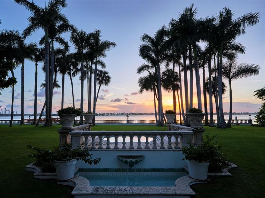 Palm Beach Grandeur- Direct waterfront compound on exceptional, rare 3+ acre estate. Located along the Intracoastal in the Estate Section, this home features stunning sunset views, boat dock, and tennis court with viewers' terrace. Landmarked home designed by Marion Sims Wyeth with 9 bedrooms, 10 full baths, and 6 powder rooms. Fantastic outdoor spaces include stunning landscaping, welcoming motor court, terraces, outdoor kitchen, beautiful koi ponds with garden bridge, and waterfront pool. Highlights include gorgeous European detailing, paneled library, elevator, and 6 car garage. Gym with built-in bar, and spa with changing room, steam shower, custom sauna, and powder room., Theater features drop-down movie screen, integrated speakers, wood paneling, and large bar. Oversized foyer open to light-filled gallery overlooking courtyard. Gourmet kitchen with top-of-the-line appliances and marble countertops and backsplash. Butler's pantry, breakfast room, and formal dining room with fireplace leading to luncheon loggia. Waterfront Owner's Wing with fireplace with dual walk-in closets and gorgeous baths. 4BR/3BA staff apartment.