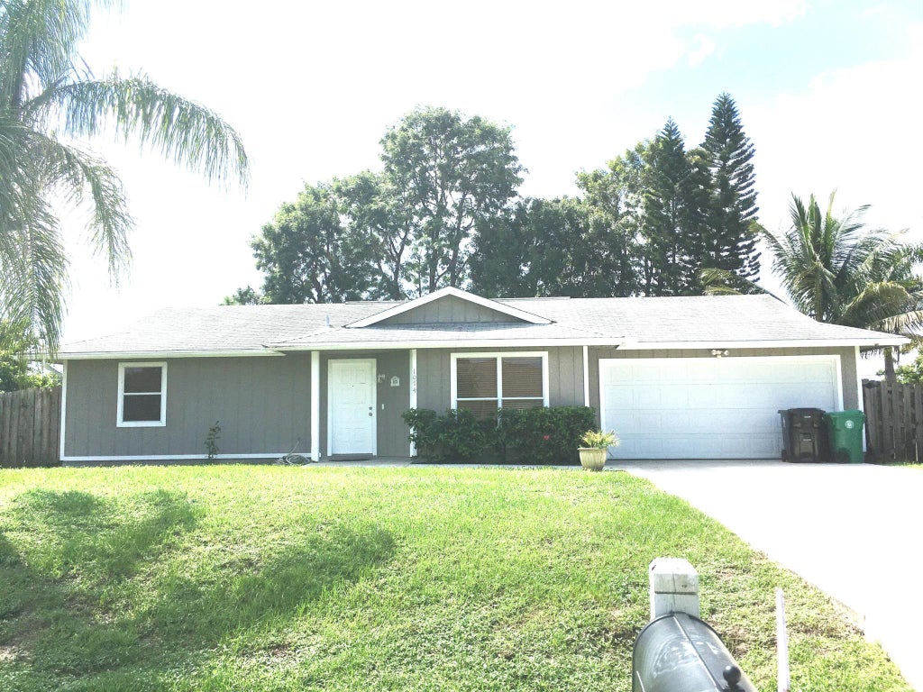 Photo of 1074 SW Janette Avenue, Port St Lucie, FL 34953 (MLS # R10835125)