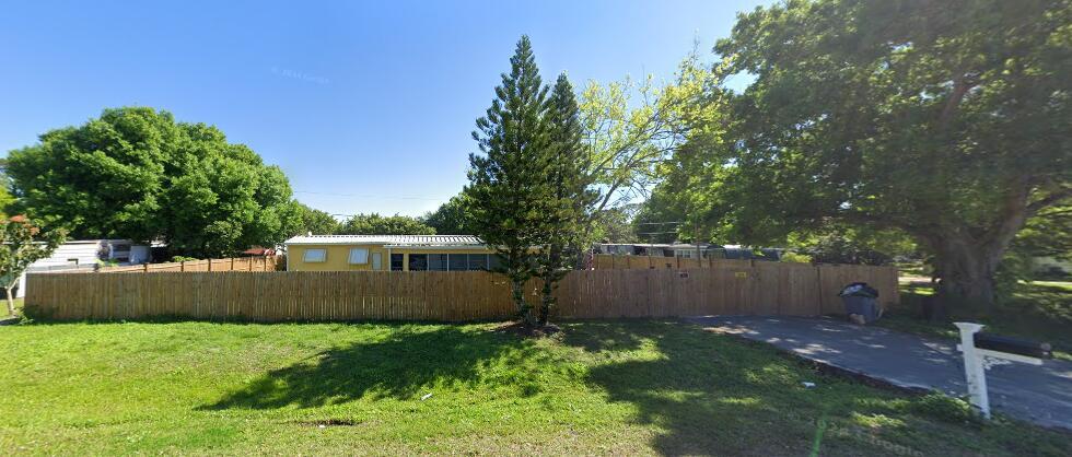 NE Section~This COZY home offers an inviting layout. Ideal for relaxing outdoors while enjoying the Florida breeze. Perfect for your year round enjoyment or as a fantastic addition to any investor's portfolio. Features: METAL roof. No HOA. Fully fenced. No FLOOD zone. Extra parking space. Outdoor shed 8 x 12. Windows awnings. On public water & Sewer. Easy commute by Hwy-70, Hwy-441 and Hwy 710. Make an offer today!