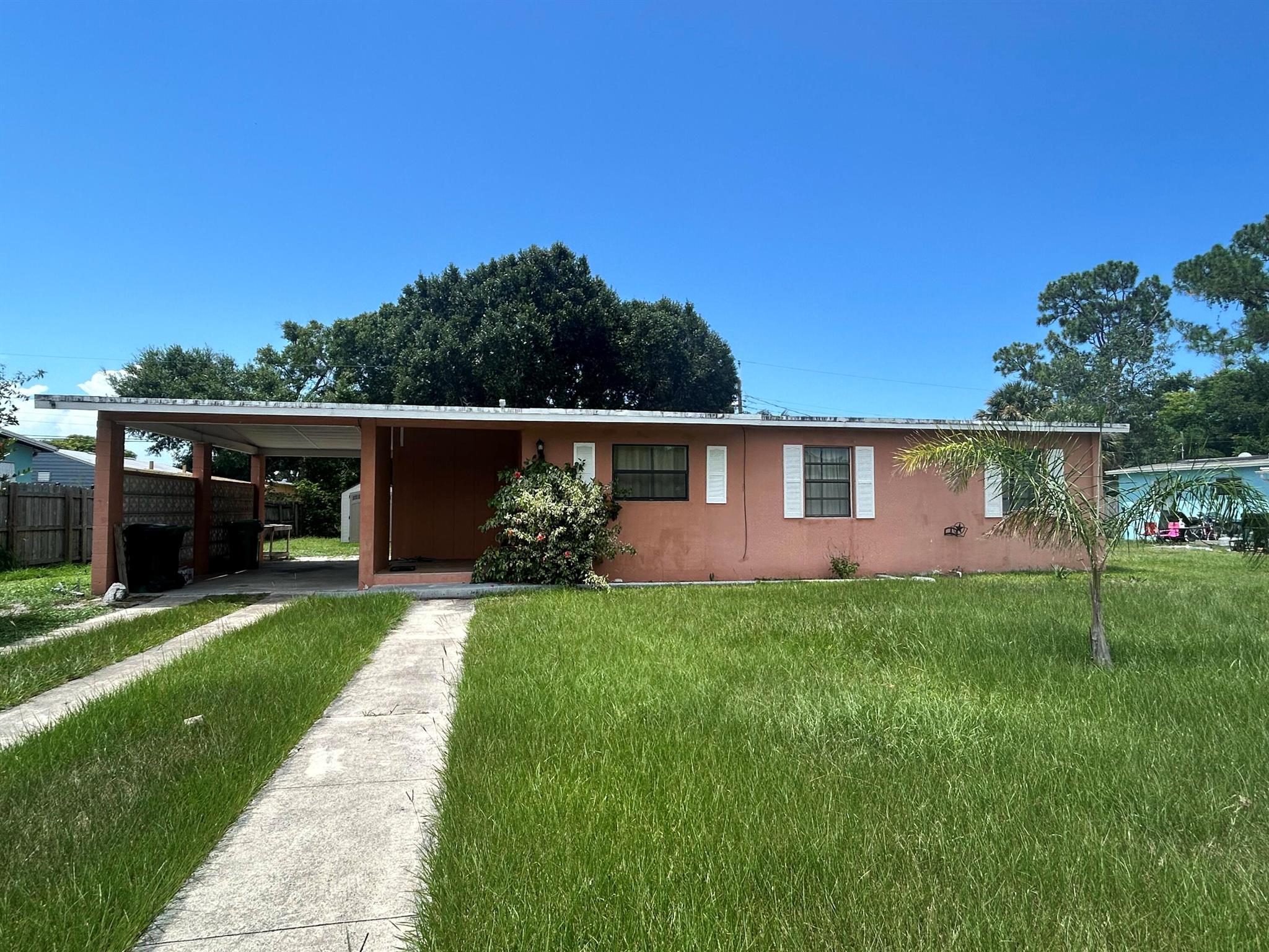 Adorable and updated 2-bedroom concrete block home in the heart of River Park. Enjoy the spacious screened porch, a lovely yard, and an attached carport for added convenience. Nestled on a quiet street, you're just minutes from shopping, dining, and everything Port St. Lucie has to offer. A charming home in a prime location--schedule your showing today!