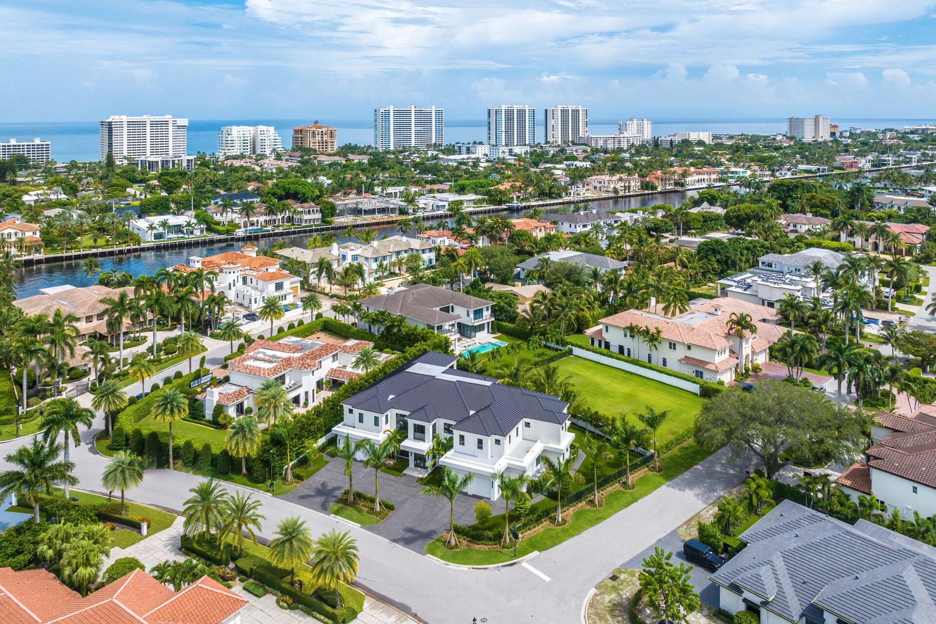 Presenting a turn-key Signature Estate by SRD Building Corp., an extraordinary residence within one of the most esteemed communities in the nation, Royal Palm Yacht & Country Club. This new construction home is situated on a prime corner lot, this exceptional estate offers over 8,200 sq ft of impeccable living space. Featuring six luxurious bedroom suites, 7 full and 2 half baths, and a spacious 4-car garage with a golf cart bay. Every detail of this property is meticulously curated to offer the most refined living.The south-facing backyard creates a sunlit sanctuary, ideal for year-round enjoyment, while the home's advanced Crestron smart-home technology and cutting-edge security system ensure seamless luxury and privacy. Interior design and furnishings by the award-winning P&H