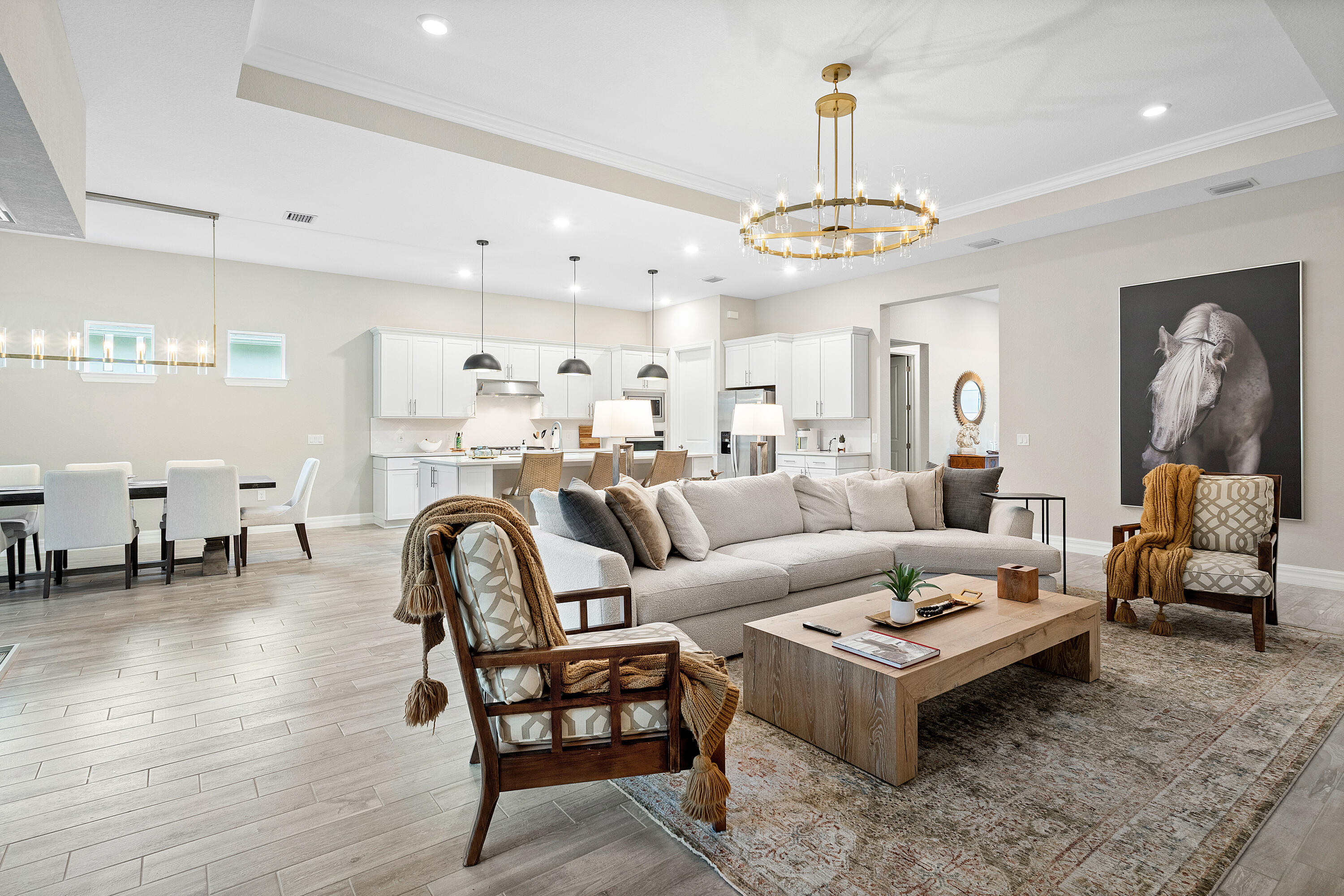 Seasonal Rental 2025-2026 furnished and fully equipped one-story home close to WEF, Polo Grounds and easy access to all dining, shopping, Palm Beach and neighboring towns. This one-story home boasts 3 bedrooms + Den (or can be a 4th bedroom), 3 bathrooms, + a bonus flex room which can be an office, playroom, gym room or sitting room. The three car garage with epoxy sealed floors is perfect for storage and all the toys! No rear neighbors, just a beautiful serene trees & prairie.The well appointed kitchen w/island overlooks the family room with large TV & dining area. You will love cooking on the gas stove and have plenty of storage in the walk-in pantry. The designer lighting and quartz countertops give this space an elevated look.