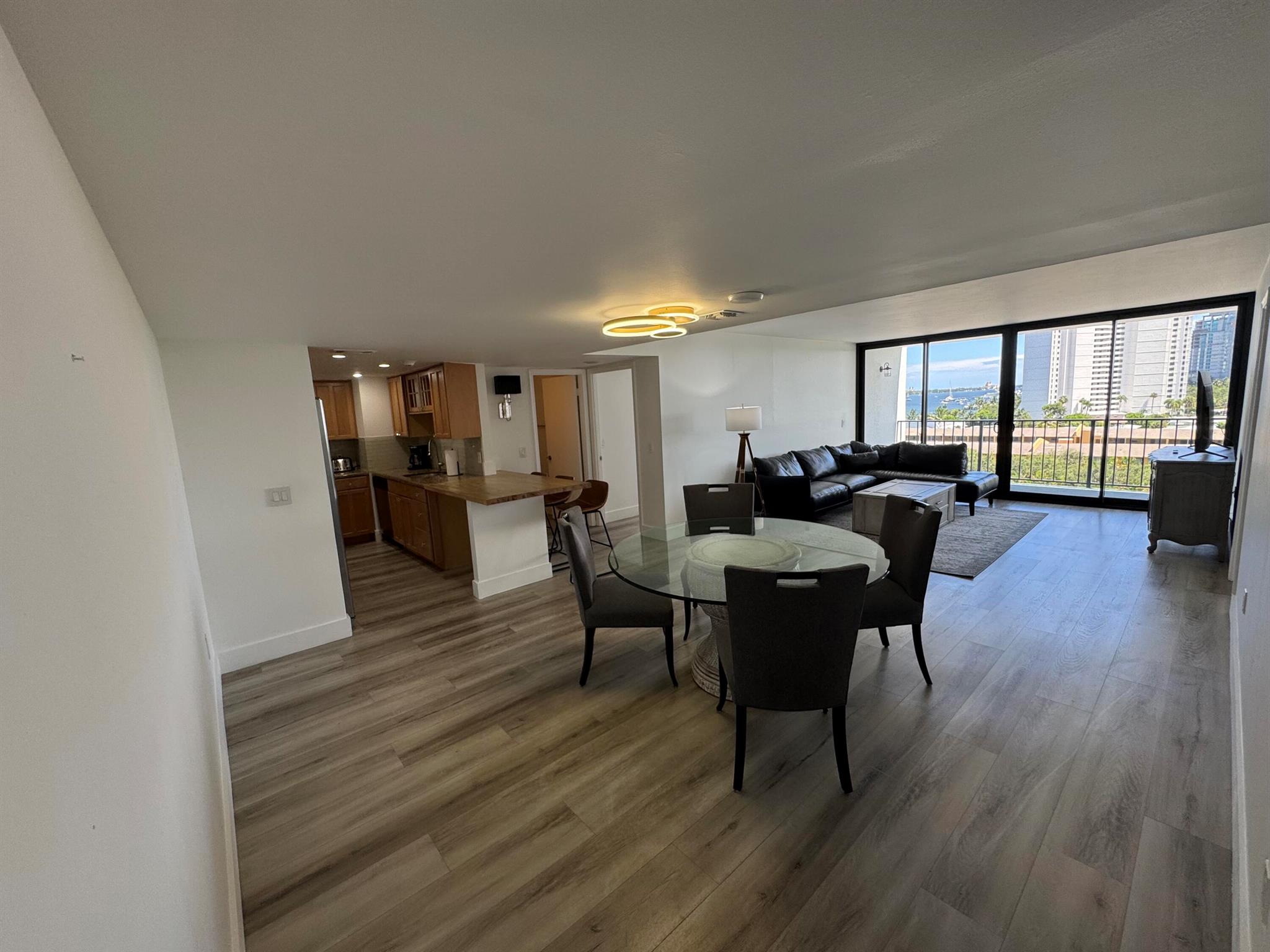 This beautifully renovated condo offers panoramic South-East views of the Intracoastal Waterway and the ocean, providing a serene and scenic backdrop. The spacious, open-concept kitchen features a newly updated design with an extended island, perfect for entertaining. Enjoy spacious living with two bedrooms and two full bathrooms.Located just 10 minutes from Palm Beach Island and Singer Island, enjoy access to world-renowned beaches, shopping, and dining. The building boasts a variety of amenities, including a billiards room, a private Intracoastal beach with a fishing dock, boat mooring capabilities, tiki hut, grills, and a heated salt-water pool.Live the coastal lifestyle with all the conveniences and luxury this unit has to offer.