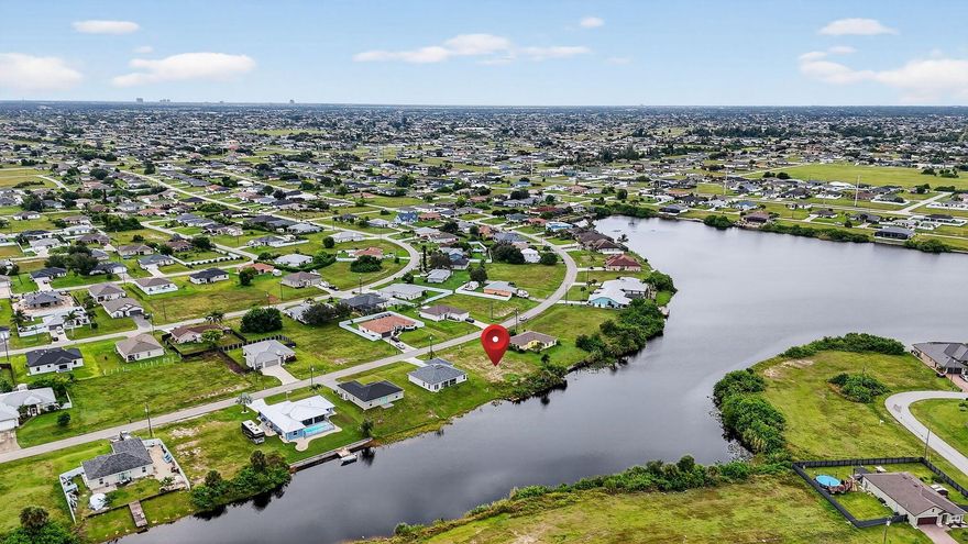 Waterfront living at an incredible price! This 10,280 sq. ft. (.24 acre) lot offers stunning Carousel Lake views and sits on a wide canal in one of Cape Coral's most desirable up-and-coming areas. Imagine building your dream home with peaceful water views, gorgeous sunsets, and quick access to the popular Coral Oaks Golf Club--just minutes away.With no HOA, you'll enjoy the freedom to design the home you truly want. The property will need well and septic, and there's currently no seawall, but neighboring new builds have been graded directly to the canal. If you choose to add one, seawalls typically range from $20K-$25K.At $56,500, this lot is priced well below comparable properties--canal lots across the water are listed at $59K-$60K, and Carousel Lake lots run between $105K-$110K.