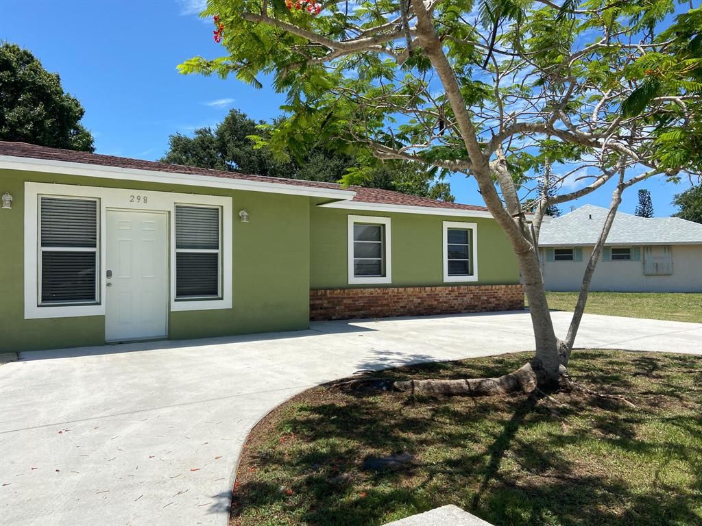 Photo of 298 NE Surrey Street, Port Saint Lucie, FL 34983 (MLS # R10722893)