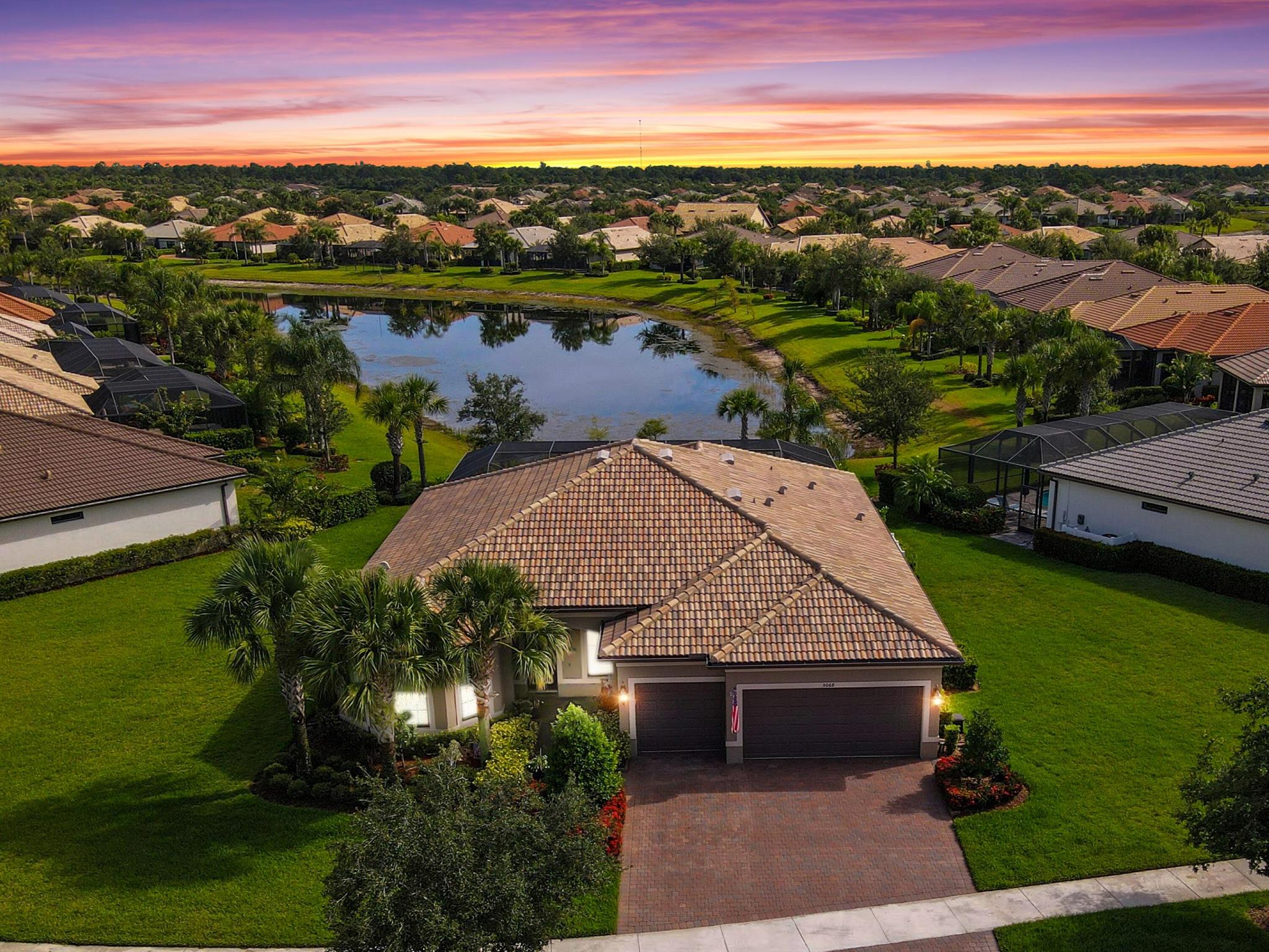 Beautifully appointed and maintained 2017 Pinnacle model with long lake view in sought after Lakes at Waterway Village. Impact glass throughout. This 3/3 plus den offers a generous 2476 SF of under air living space. Substantial upgrades and features - see feature slide in photos. Seamless Florida indoor/outdoor living is accessed via zero-corner patio doors to screened salt water pool and covered lanai entertaining area. Gated community offers resort amenities - active social calendar - Clubhouse, Kitchen, Barefoot Bar, Pool w/lap lanes, Spa, Gym, Studio, Tennis courts, Bocce & Pickleball