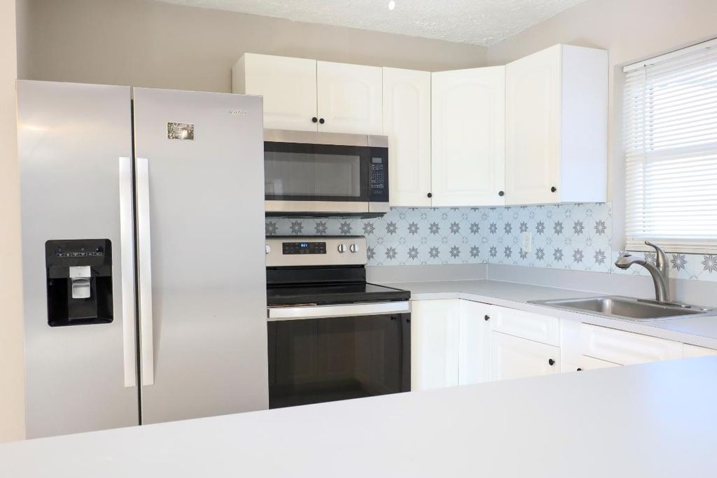 Photo of 1285 SE Port St Lucie Boulevard, Port Saint Lucie, FL 34952 (MLS # R11151659)