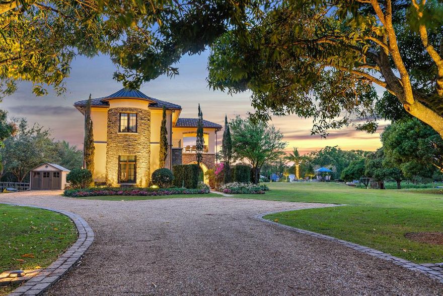 OPPORTUNITY AWAITS! If you have been searching for the PERFECT waterfront lot to build the home of your dreams, look no further! $3M AS-IS with approved building plans for main house or $5M total cost including building the main house. Available just in time for the 2021 summer season is this spectacular 2.43 acre cleared lot boasting 270 degrees of mesmerizing water views, a HUGE luxurious pool and spa, private dock + boat lift, and the most charming Tuscany-inspired guest house, PLUS it has already approved plans to build an incredible 6,000 square foot main house. Boasting 2,400 square feet of living space, 3 bedrooms, 2 full bathrooms, impact windows & doors, and stunning views of the pool and water, this gorgeous two-story CBS guest house is the perfect place to live while building