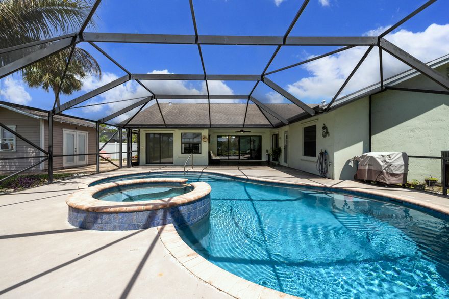 Discover the perfect blend of indoor and outdoor living in this 4bedroom, 2.5bathroom pool home on a 0.37acre CUL-DE-SAC lot in a LOWHOA community. NEW ROOF being installed in June 2026. Tileplank flooring runs throughout the home. The kitchen features butcherblock and marble tile countertops, stainless steel appliances, a gas stove with a vent, ample cabinetry, and a pantry. The bright, spacious primary suite includes a walkin closet, an ensuite bathroom, and direct access to the pool. The laundry room offers a fullsize washer and dryer. A standout feature is the detached shed, which includes a Murphy bed, electricity, and Ethernet, plus an outdoor shower - ideal for guests, hobbies, or a quiet workspace. Enjoy the saltwater, screenedin pool and the privacy of a fully fenced  yard. The 2car garage and expansive driveway can accommodate up to eight cars. Additional features include a 2023 water heater, generator hookup, and the pool was refinished in 2022. Located in Lexington Estates, this area has A-rated elementary and middle schools and a B-rated high school. Minutes from shopping, dining, the Turnpike, and I95. The beach is 8 miles away and PBI Airport is 14 miles away. All measurements are approximate. Be sure to view the 3D virtual walkthrough.