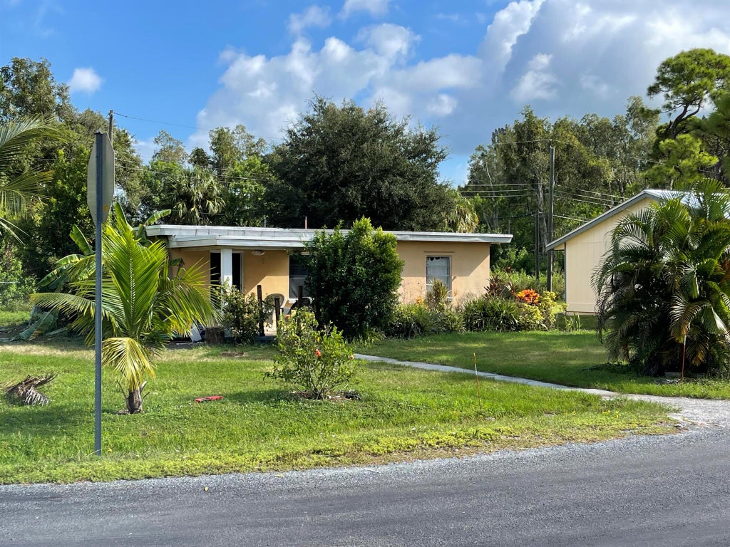 Photo of 3504 W Lake Drive, Fort Pierce, FL 34982 (MLS # R10920110)