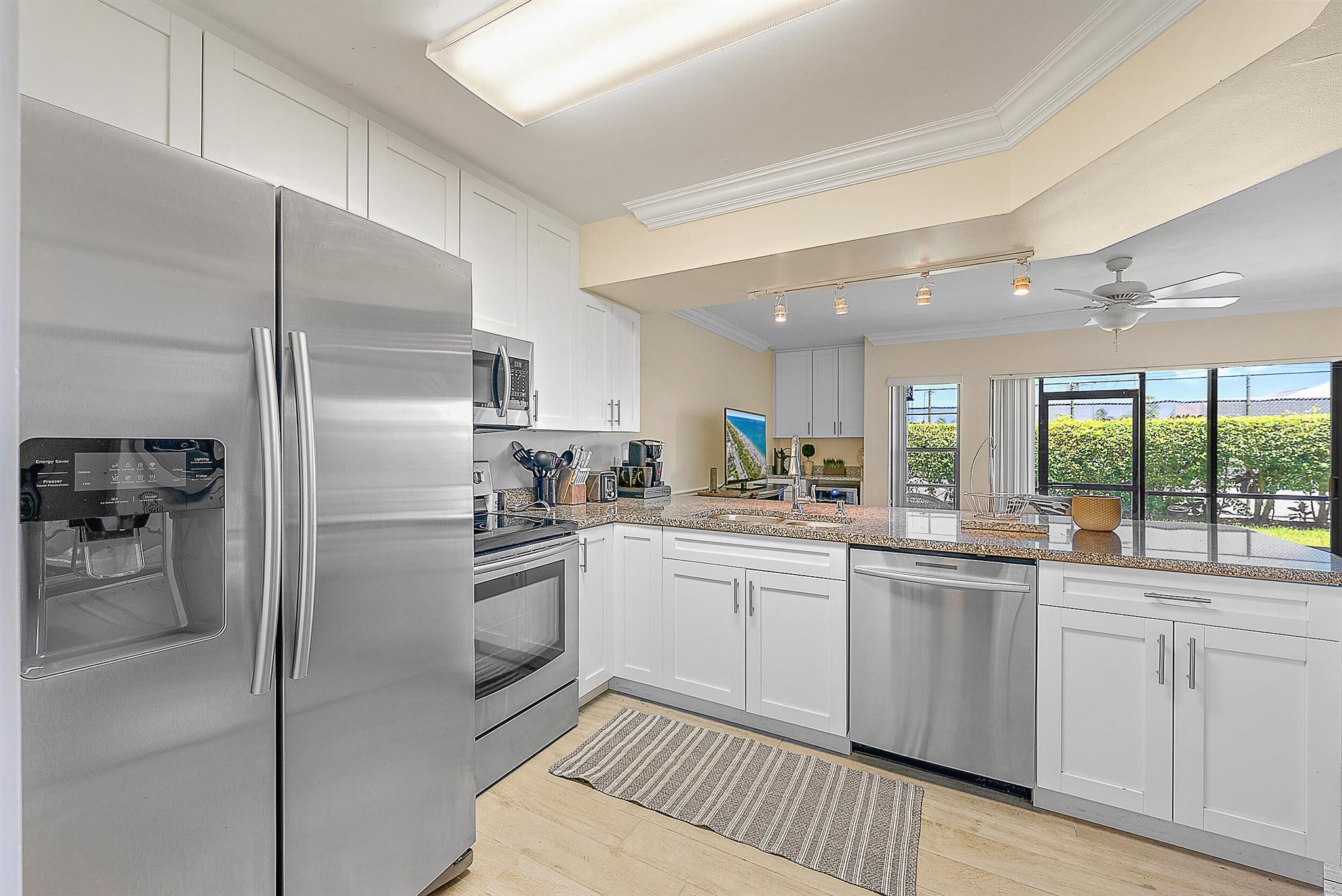 TURNKEY AND FULLY FURNISHED - bring your personal items and move right into this beautifully furnished, updated and upgraded, first floor 1-bedroom, 1.5-bathroom condo located just a short distance from the dog friendly Jupiter Beach. This condo has been updated with tile floors throughout, stainless steel appliances in the kitchen, built-in bar area with a wine refrigerator, updated bathrooms, stacked washer and dryer and so much more. Assigned parking spot, community clubhouse and pool, evening security and manager on site are just some amenities you'll enjoy. The highly desirable location in Jupiter is sought after for its proximity to the beach, restaurants and entertainment. Don't miss this opportunity to own your piece of paradise.