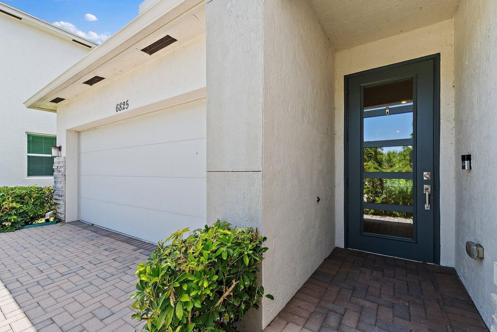Photo of 6825 Pointe Of Woods Drive, West Palm Beach, FL 33413 (MLS # R11097451)
