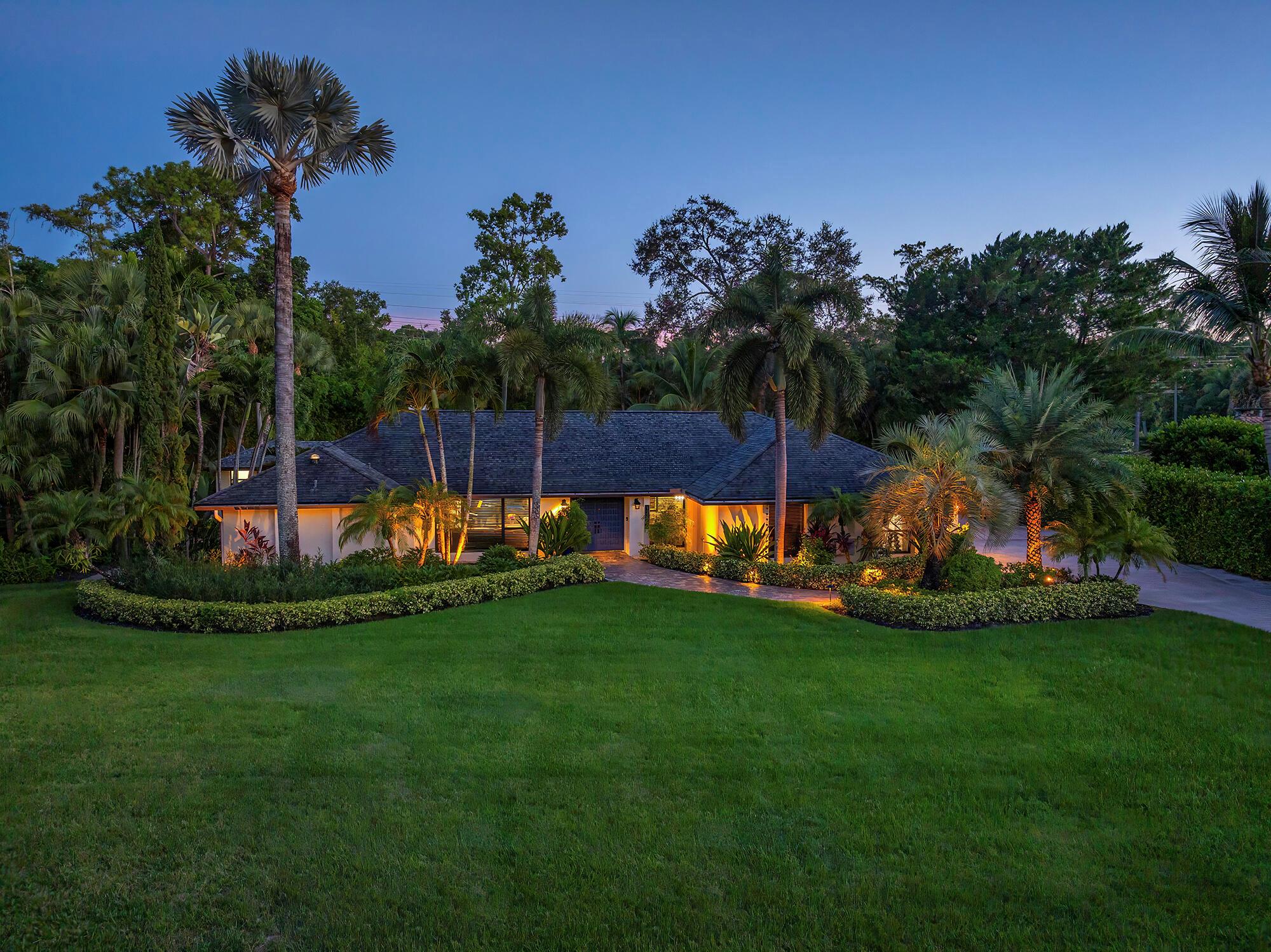 Seasonal Luxury Retreat in Wellington - Close to WEF, Polo & Palm BeachWelcome to your private South Florida retreat, a lush tropical paradise set on a fully fenced acre in the heart of Wellington. This single-story ranch estate has been completely remodeled inside and out, offering nearly 3,000 sq. ft. of like-new living space plus an additional 1,500 sq. ft. of screened-in outdoor living designed for seamless entertaining and relaxation.Inside, the open-concept great room boasts vaulted ceilings, rich wood floors, and sliding glass doors that blend indoor and outdoor living. The chef's kitchen features quartz countertops, stainless steel appliances, and custom cabinetry with a pass-through window for easy outdoor dining.