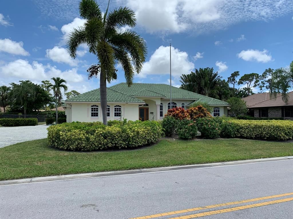 Photo of 454 S Country Club Drive, Atlantis, FL 33462 (MLS # R10725734)