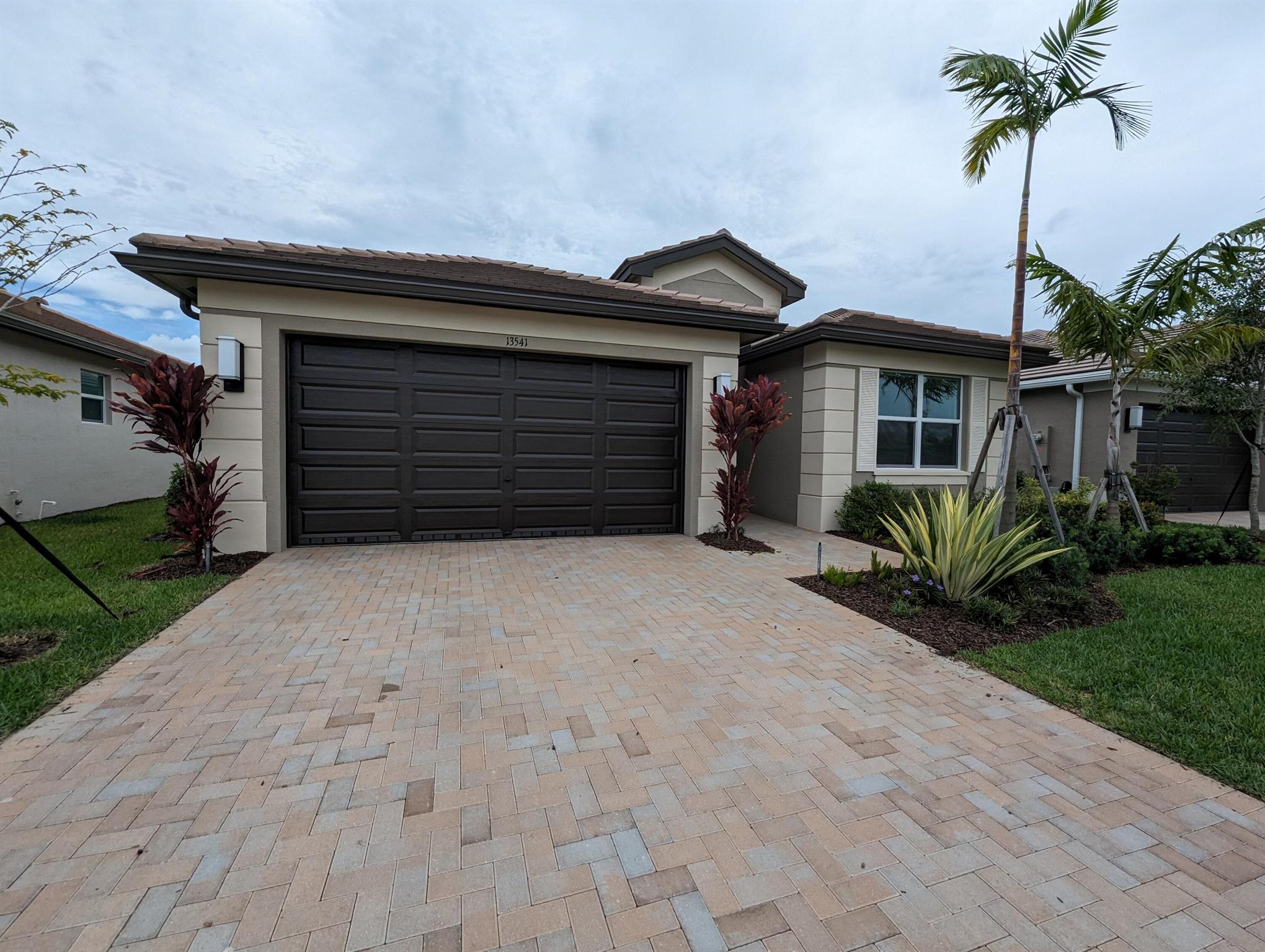 This single family home is the Osprey floorplan located in the gated community of Valencia Grove (55+). It offers 2 bedrooms, 1 den, 2 bathrooms, and a 2 car garage. As you step inside, you'll be greeted by soaring ceiling and an bundance of natural light. With tile floors throughout the home, this open floorplan, has a spacious living and dining area, modern kitchen complete with stainless steel appliances, and granite countertops. The owners suite features a large walk-in closet, dual sinks, and a walk-in shower. Covered patio is screened in and home has impact-resistant windows. Community offers clubhouse, fitness center, pool, tennis, pickleball, and more. Schedule a tour today! Pets welcomed, first, last, and security deposit required.