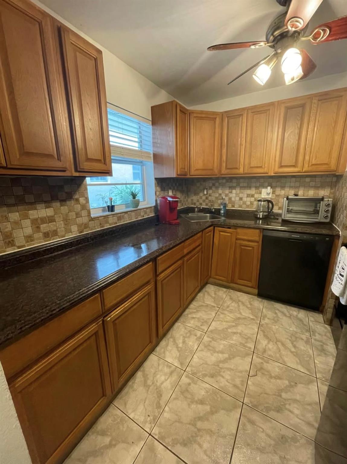 Investor’s Dream in Margate, FL! This beautifully remodeled ground-floor corner condo offers 2 bedrooms and 2 bathrooms, filled with natural light thanks to extra windows. The modern kitchen features stylish countertops and cabinetry, complemented by stylish laminate and tile flooring throughout. Both bathrooms have been fully updated with new vanities and elegant tile, creating a sleek and contemporary feel. From the living spaces, enjoy peaceful garden views in a welcoming all-ages community. The property is an ideal investment, with a reliable long-term tenant currently paying $1,650 per month and wishing to stay, ensuring immediate and steady rental income. low HOA fees, Showings require advance notice.