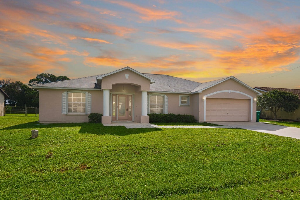 Photo of 1831 SE Mantua Street, Port Saint Lucie, FL 34952 (MLS # B26071923)