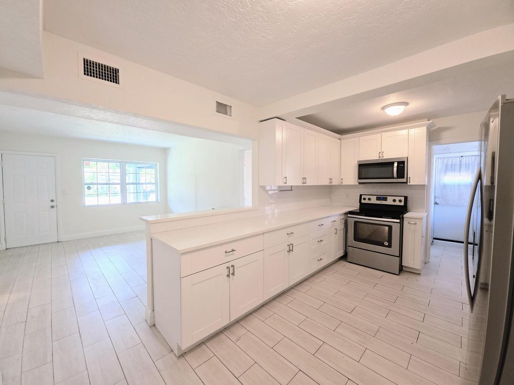 Photo of 1220 NE 1ST Avenue, Fort Lauderdale, FL 33304 (MLS # B26051933)