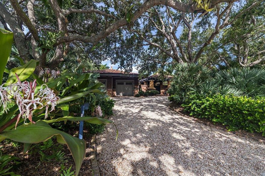 Where a Grand Polynesian bungalow meets British Caribbean style. With over 4,500 square feet under air and approximately 6,600 total square feet under roof, this sprawling 1 story estate home exudes luxury while making privacy a priority. Situated on over half an acre of land, in 2001, this home was redesigned, taken back to the studs and added on to. A three year design and build process resulted in a truly unique living space perfect for the most discerning buyer. The bedrooms are both cozy and charming, each with their own private courtyard &/ or garden views. The comfortable family room is adjacent to the kitchen and incorporates a large dining space while overlooking the lush tropical landscaping, the swimming pool and its coquina gratos. Offering an entertaining space unlike any