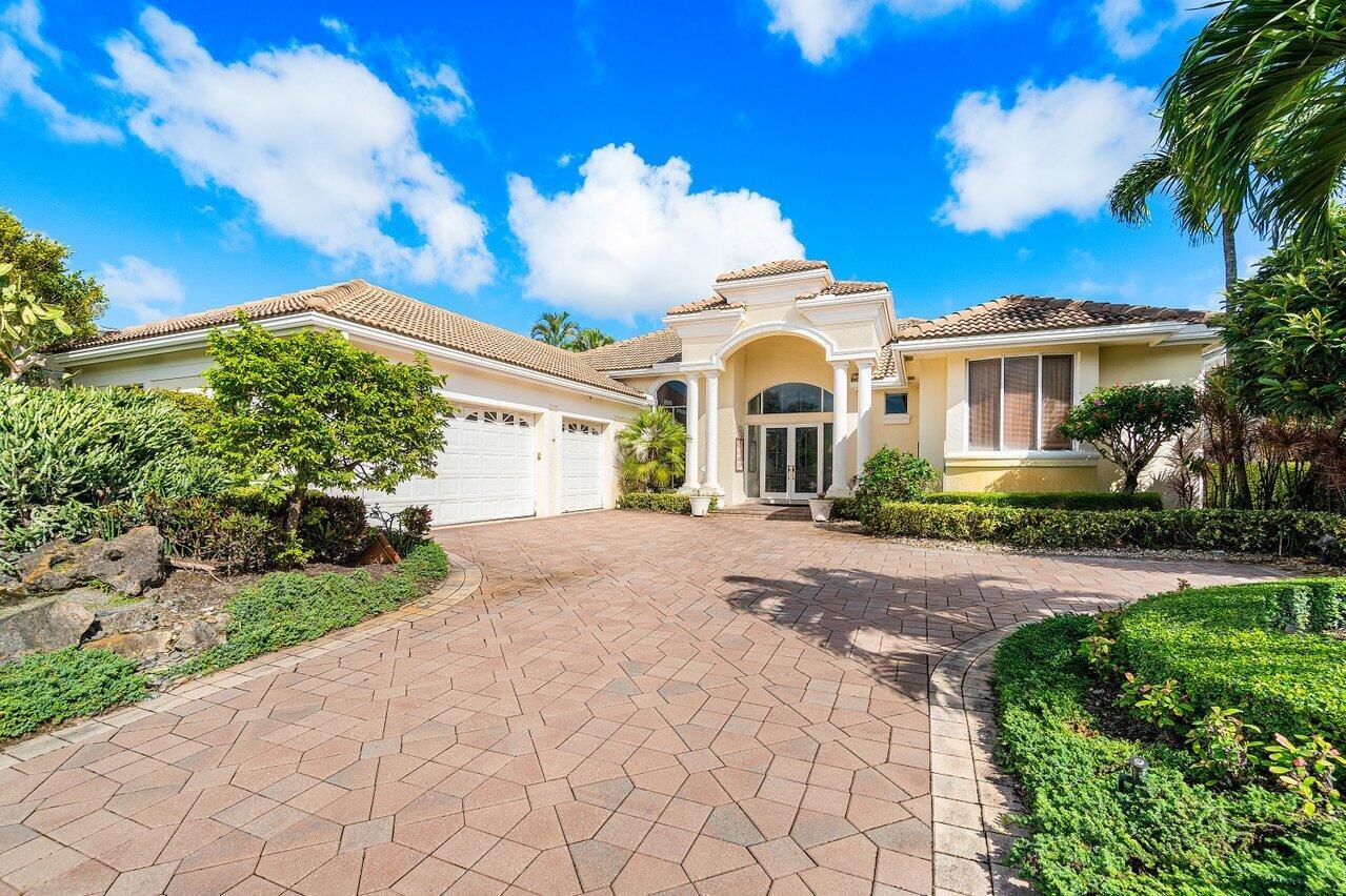Welcome to this Custom Built Estate located in the exclusive Coquina Estates of BallenIsles! Spacious 4 BR / 4.5 BA with over 3,300 square feet of living space. Expansive driveway leads you to a glass enclosed double door entry. Step into the bright and airy high ceiling, open/split floor plan offering the best of the open concept feel combined with some degree of room separation. Foyer and formal living room feature floor-to-ceiling windows showcasing breathtaking views of the outdoor patio, pool and spa. Enjoy panoramic views of the 15th fairway of the BallenIsles South Course. Host guests for dinner in the elegant dining room to the left of the entrance foyer. Move into the Kitchen with center island which opens up into a very large family room with custom (SEE MORE)...