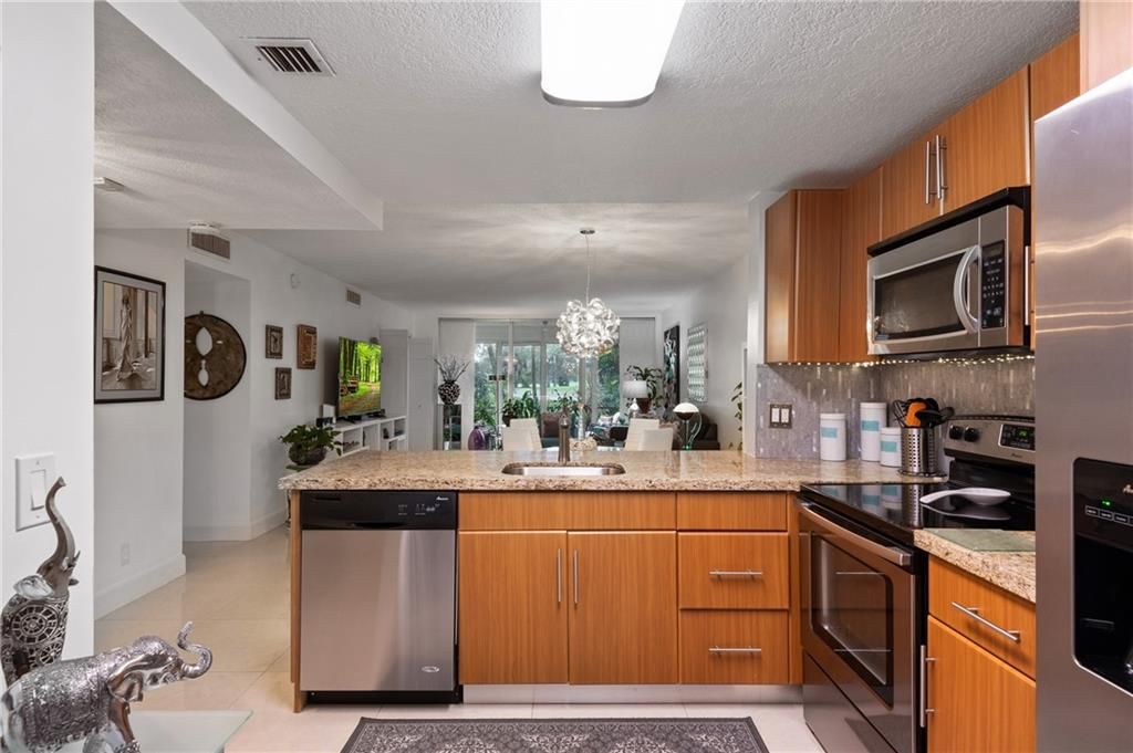 Photo of 605 Oaks Dr #108, Pompano Beach, FL 33069 (MLS # F10316939)