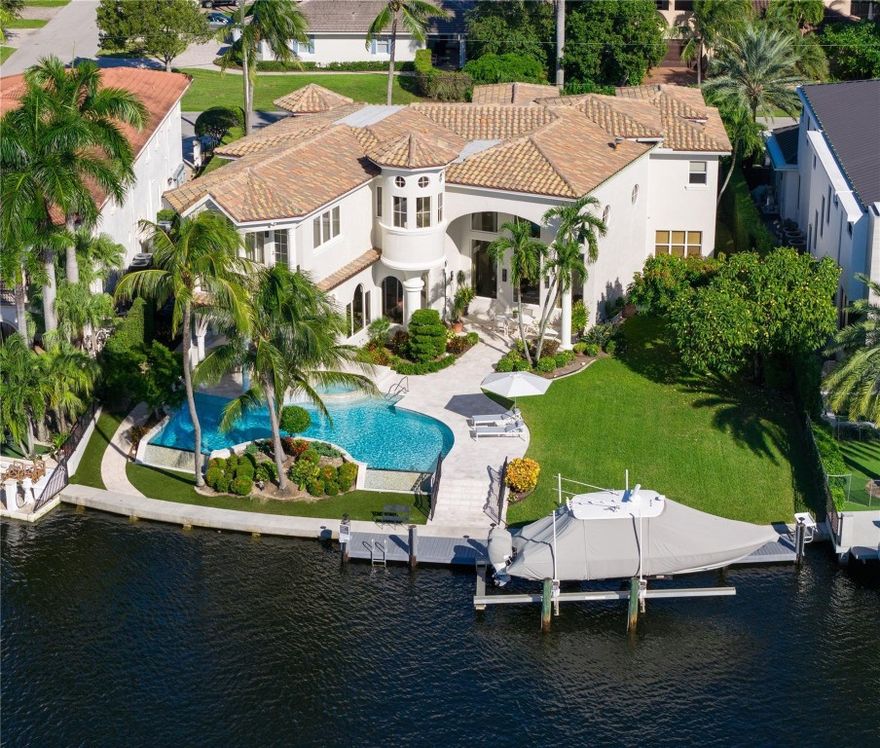Ensconced in the yachting enclave of Lighthouse Point, this Custom Deepwater Estate is a masterpiece sited on 101’ of waterfrontage with rare wide water views on an impressive, oversized lot. A stone driveway creates a sense of arrival into the estate’s picturesque facade w/gated courtyard entrance. Transcend through the updated interiors comprised of a 2-story foyer/living room, new chef’s kitchen, formal dining & gym/den. Upstairs features master suite w/primary bath boasting new luxury finishes, private balcony & dual closets. Amenities include 4-bay garage, Impact Windows & Doors, 45KW generator, storage room, wine cellar & 2020 roof. Outdoor entertainment is enjoyed at the covered loggia, verdant yards & infinity-edge pool. Full service yacht dock w/boatlift minutes to Hillsboro Inlet DISCLAIMER: Information published or otherwise provided by the listing company and its representatives including but not limited to prices, measurements, square footages, lot sizes, calculations, statistics, and videos are deemed reliable but are not guaranteed and are subject to errors, omissions or changes without notice. All such information should be independently verified by any prospective purchaser or seller. Parties should perform their own due diligence to verify such information prior to a sale or listing. Listing company expressly disclaims any warranty or representation regarding such information. Prices published are either list price, sold price, and/or last asking price. The listing company participates in the Multiple Listing Service and IDX. The properties published as listed and sold are not necessarily exclusive to listing company and may be listed or have sold with other members of the Multiple Listing Service. Transactions where listing company represented both buyers and sellers are calculated as two sales. “No payments made until title passes” Some affiliations may not be applicable to certain geographic areas. If your property is currently listed with another broker, please disregard any solicitation for services. Information published or otherwise provided by seller, listing company or its representatives is deemed reliable but are not guaranteed and subject to errors, omissions, or changes without notice. Copyright 2025 by the listing company. All Rights Reserved.