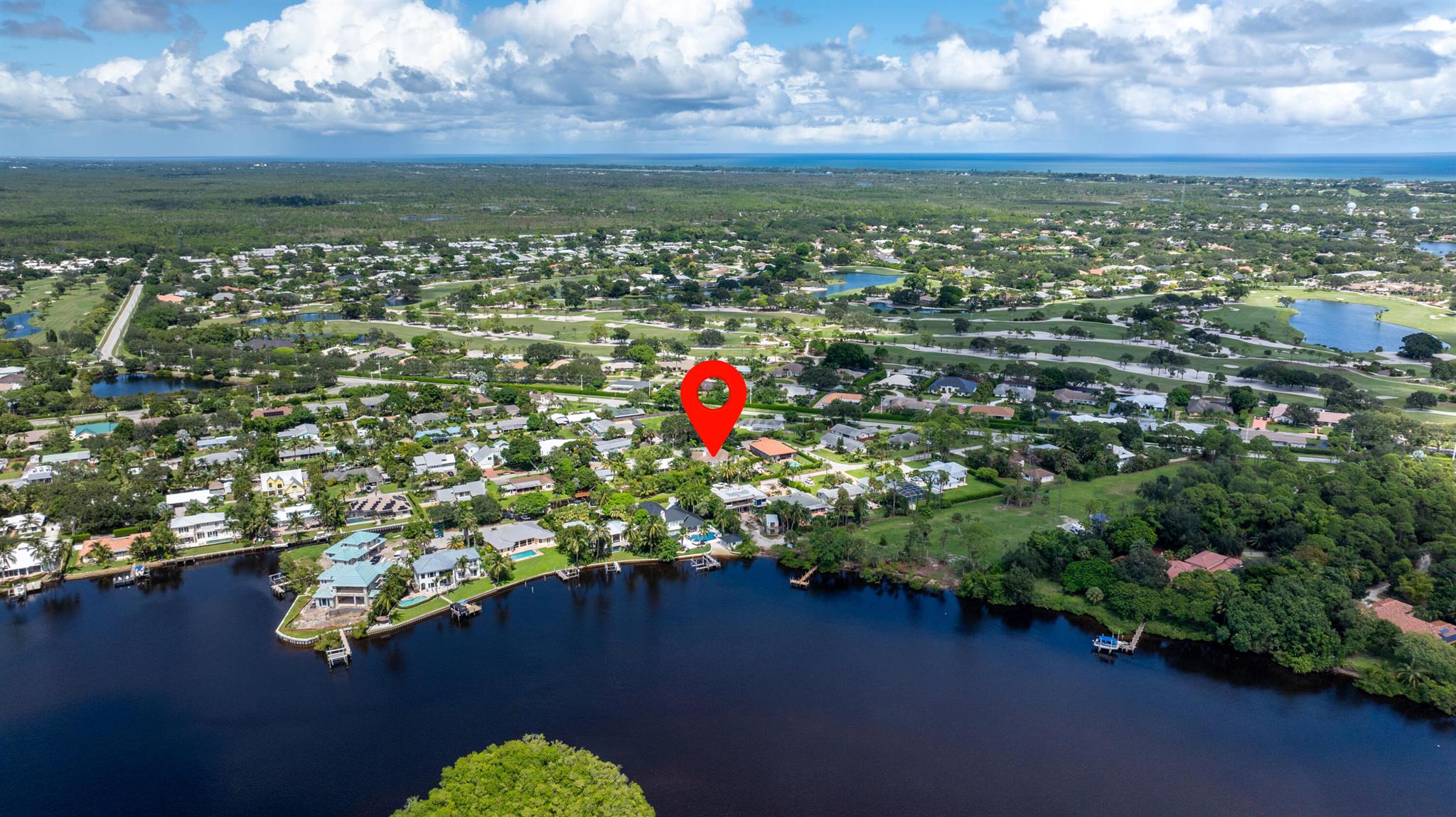 Enjoy the best of Jupiter living! This beautiful 3BR 2BA waterfront pool home is ready for you! This home is a boater's dream with no HOA, situated on 85' of water with direct access to the Loxahatchee river. No fixed bridges! Enjoy light & bright, open-concept living complete with high-end finishes, tile floors and a coastal modern design. The gourmet kitchen features top-of-the-line appliances, custom cabinetry, and quartz countertops with ample entertaining space. The finished garage has room for your cars & storage. Outside, the resort-style backyard is your private oasis--enjoy the newly resurfaced pool, tiki hut, and a private dock with a 12K lb boat lift. Impact windows throughout! Don't miss this opportunity to own a waterfront home in one of Jupiter's best kept secrets