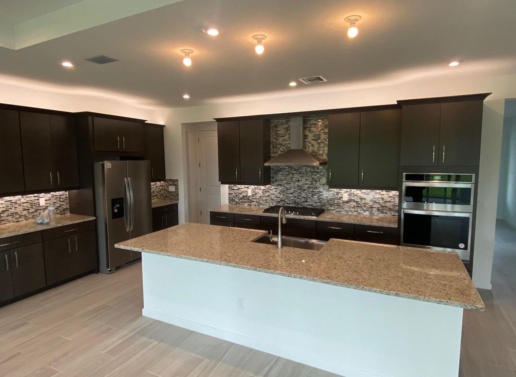 Photo of 10718 SW Hensley Street, Port Saint Lucie, FL 34987 (MLS # R11159582)