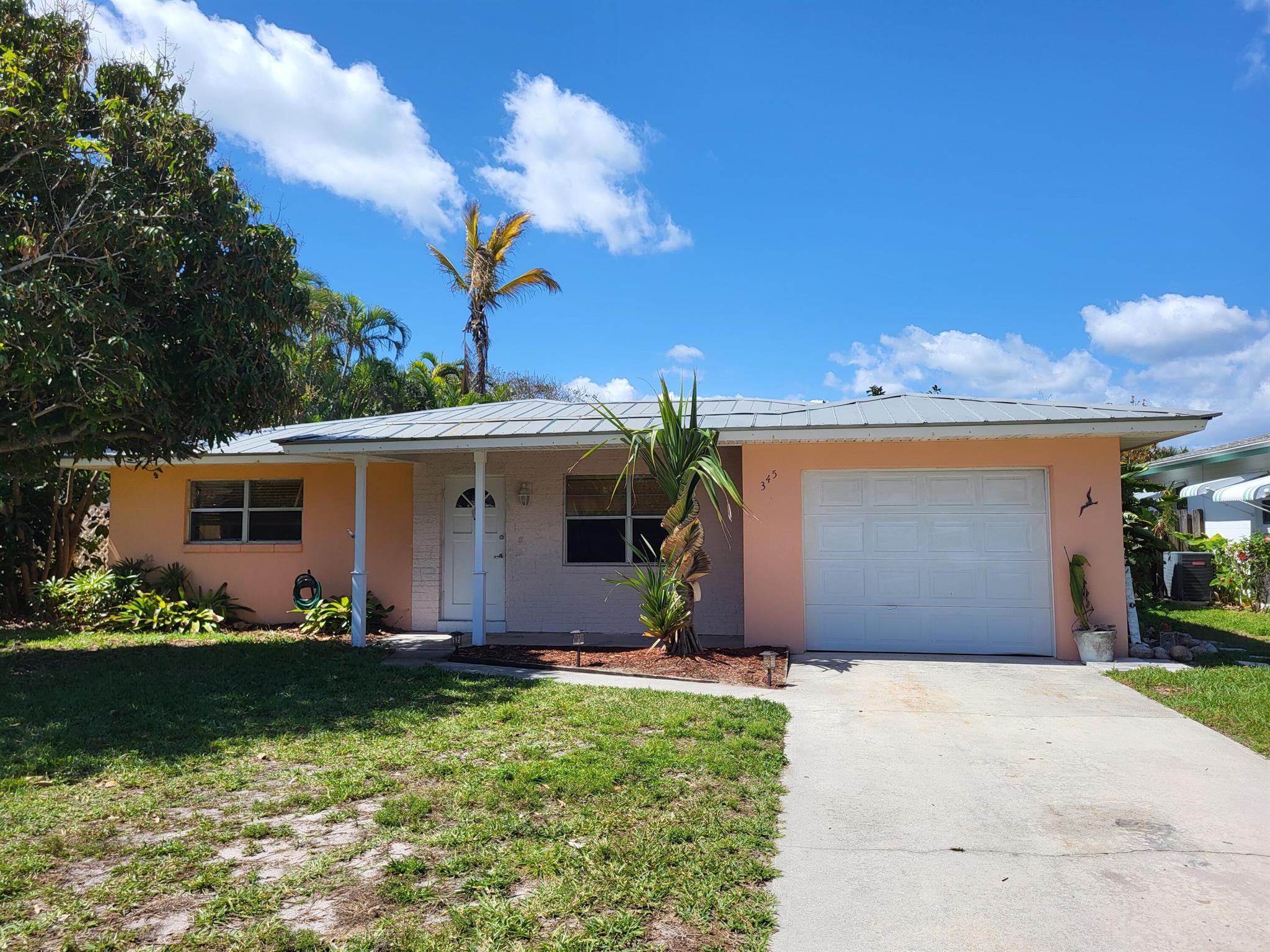 Cozy 2BR/2BA single family house with a garage. Open layout. Ceramic tile throughout. Located 3 blocks from public ocean access. No HOA. Includes all appliances, stove, refrigerator, dishwasher, microwave, washer & dryer. First, last and security deposit due at signing of lease. Annual lease only. Application, proof of income, no evictions.