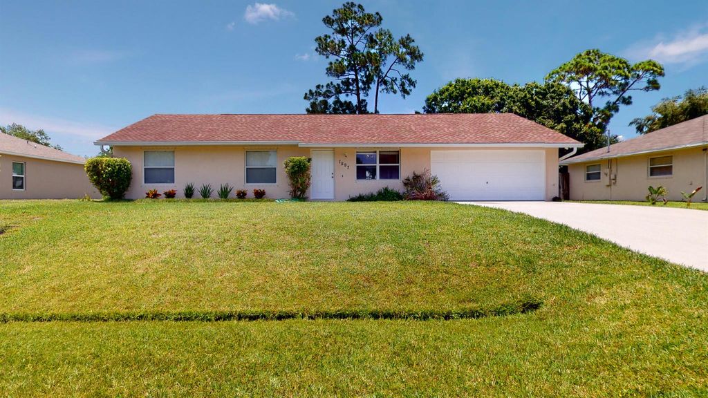 Photo of 1597 SW Bellevue Avenue, Port St Lucie, FL 34953 (MLS # R10900642)
